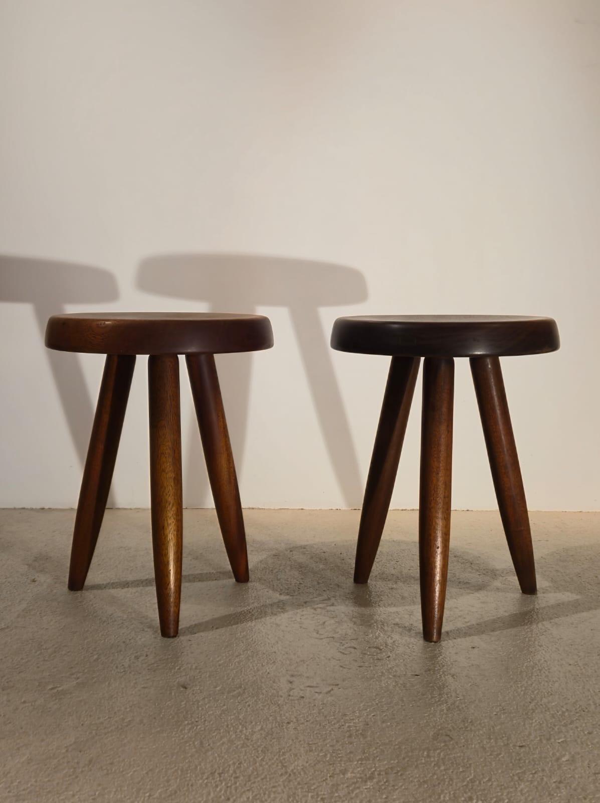 Mahogany Nice pair of berger stools by Charlotte Perriand. Nice provenance For Sale