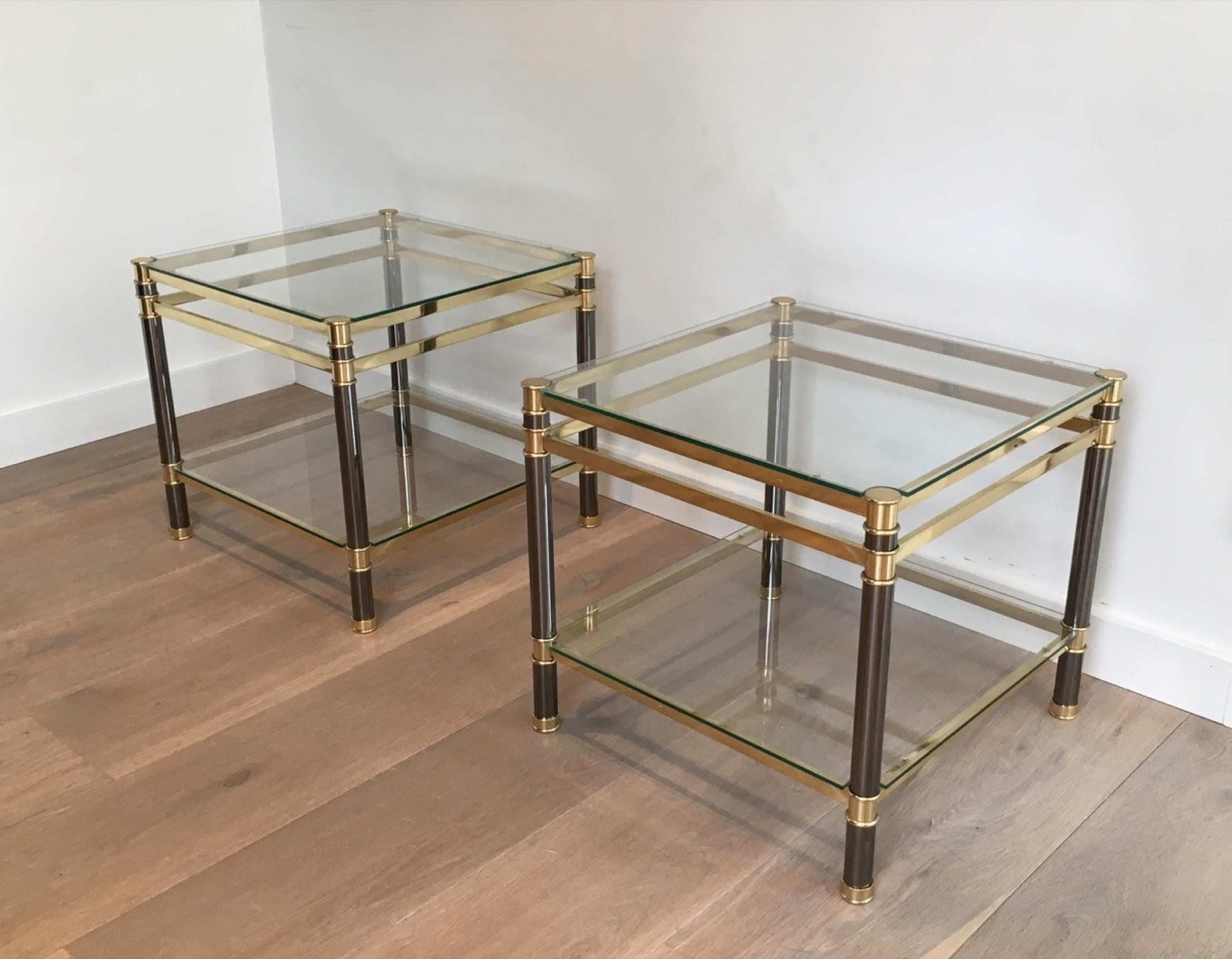 This pair of side tables is made of gun metal and brass. This is a French design, circa 1970.