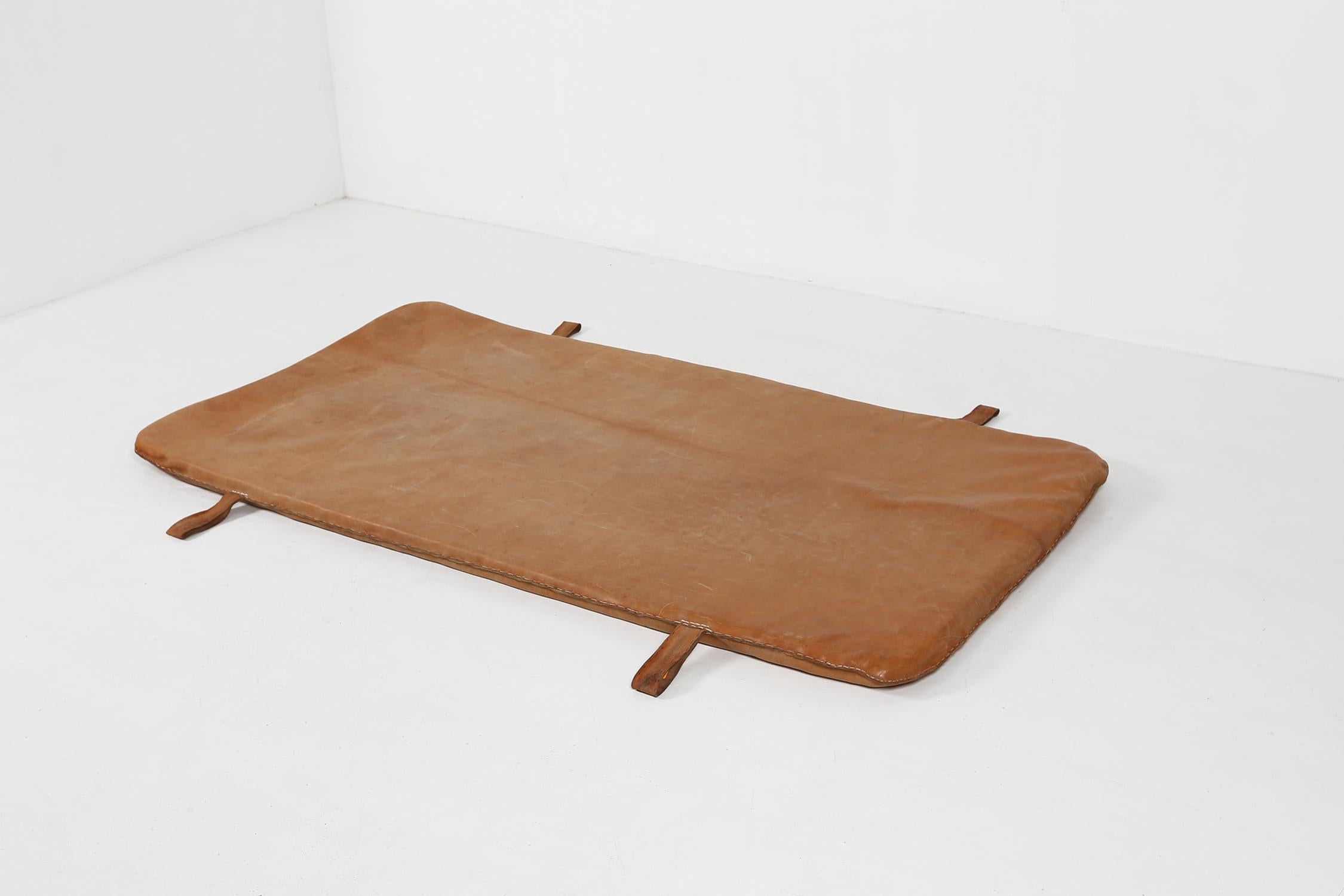 Belgium / 1930s / gym mat / brown thick cow leather / vintage / industrial  

Step back in time to the 1930s with this nice patinated leather gym mat crafted in Belgium. Made from premium brown thick cow leather, this vintage piece is an eye-catcher