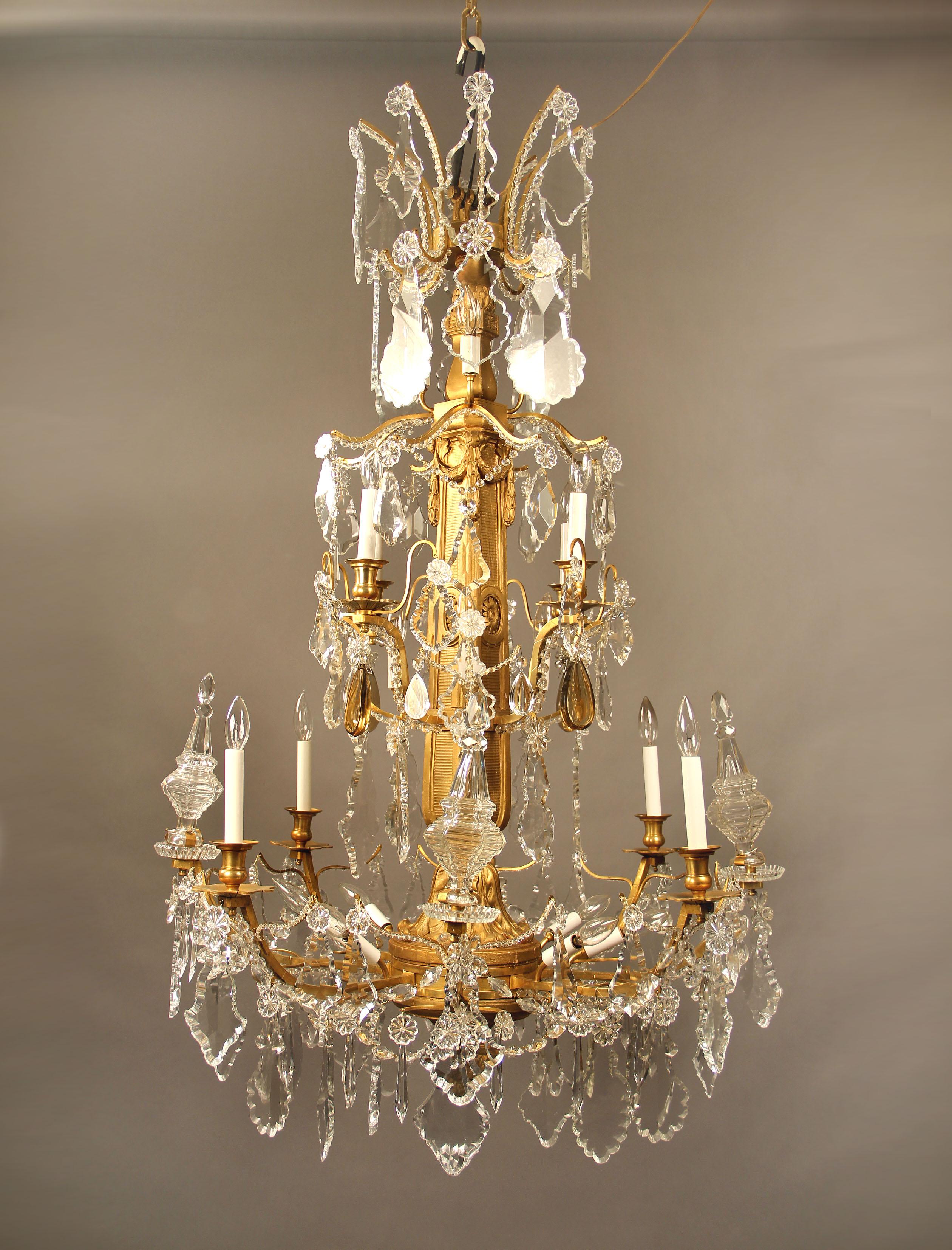 A nice quality late 19th century giltwood, gilt bronze and baccarat crystal twenty four light chandelier

Multi-faceted and shape crystal, four spears, beaded arms and faceted crystal swags, eight tiered perimeter and sixteen tiered interior