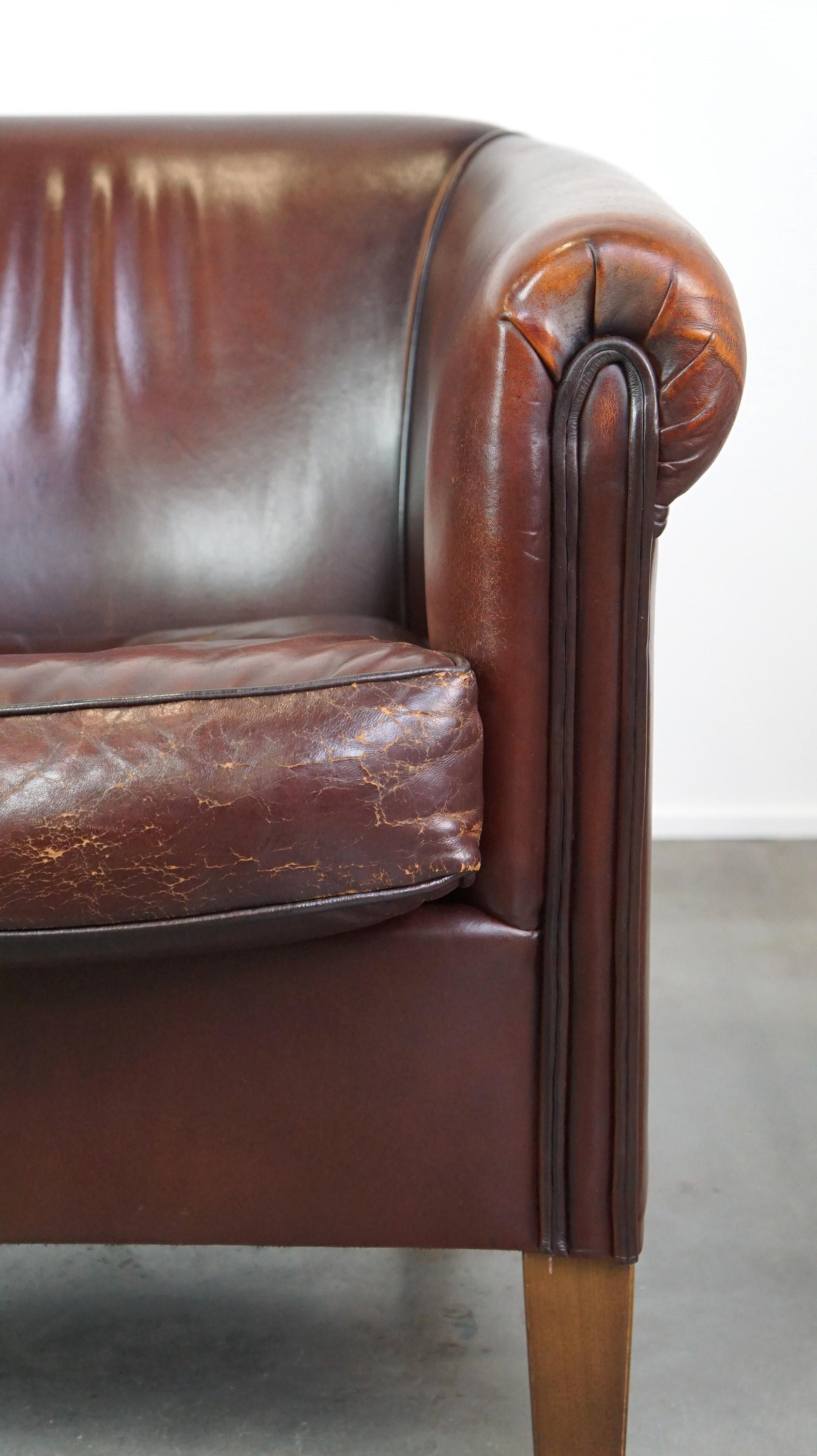 Nice sheepskin club chair with a beautiful patina For Sale 3