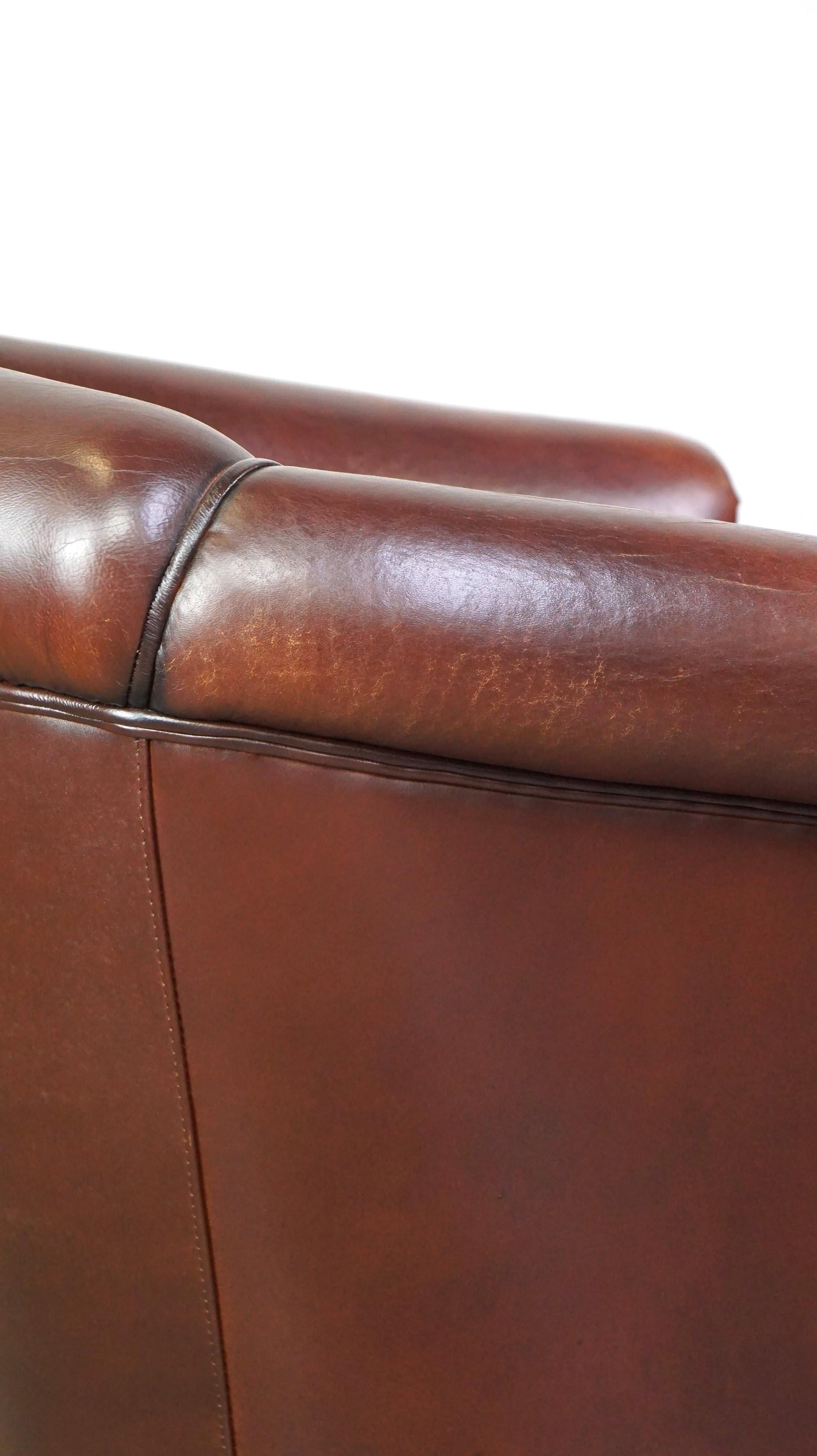 Nice sheepskin club chair with a beautiful patina For Sale 6
