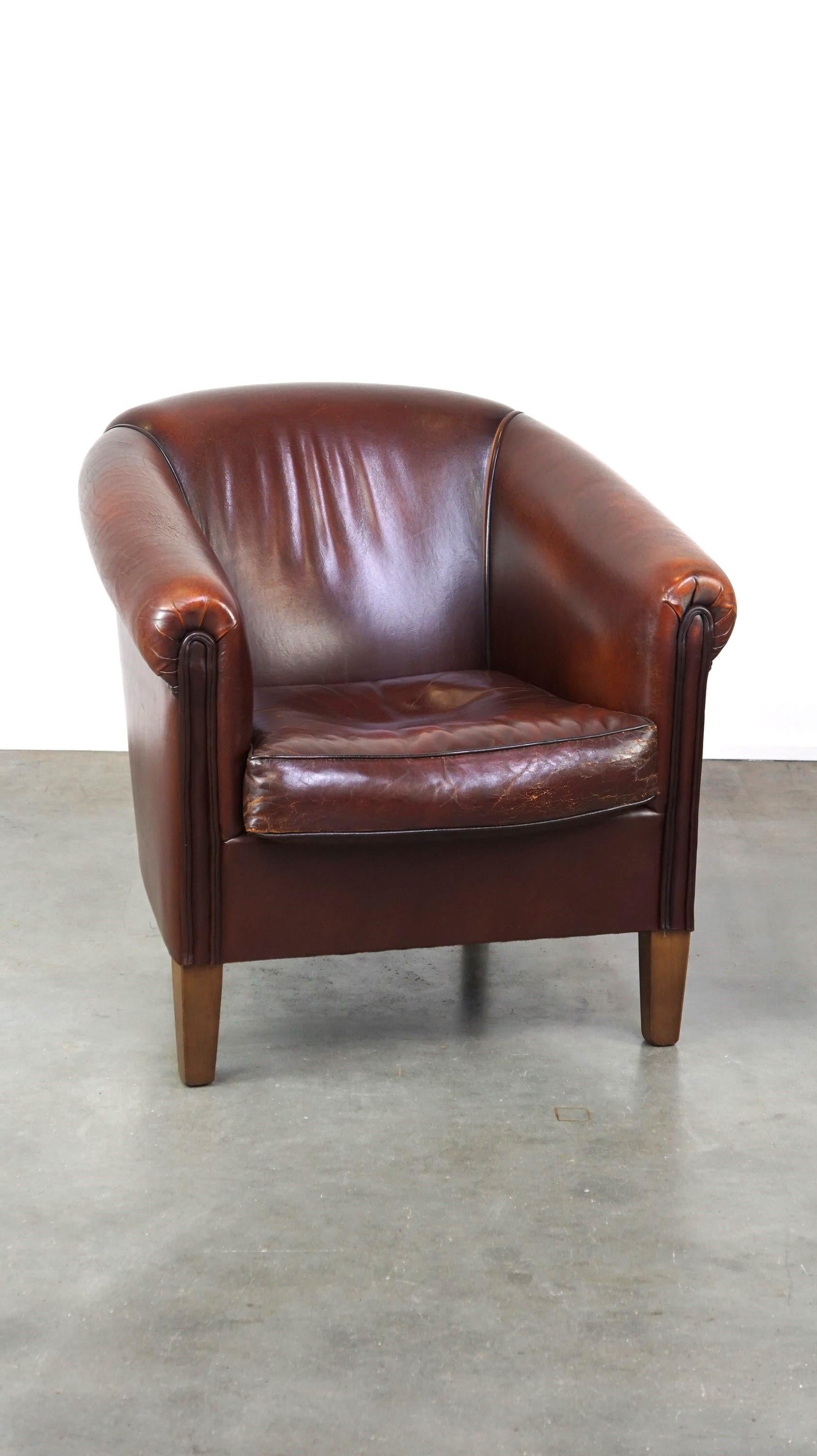 Offered this nice sheep leather club chair with a beautiful patina.

This nice and comfortable sheep leather club chair has acquired a beautiful patina through years of loving use. It can easily be placed in almost any interior, style and space. The