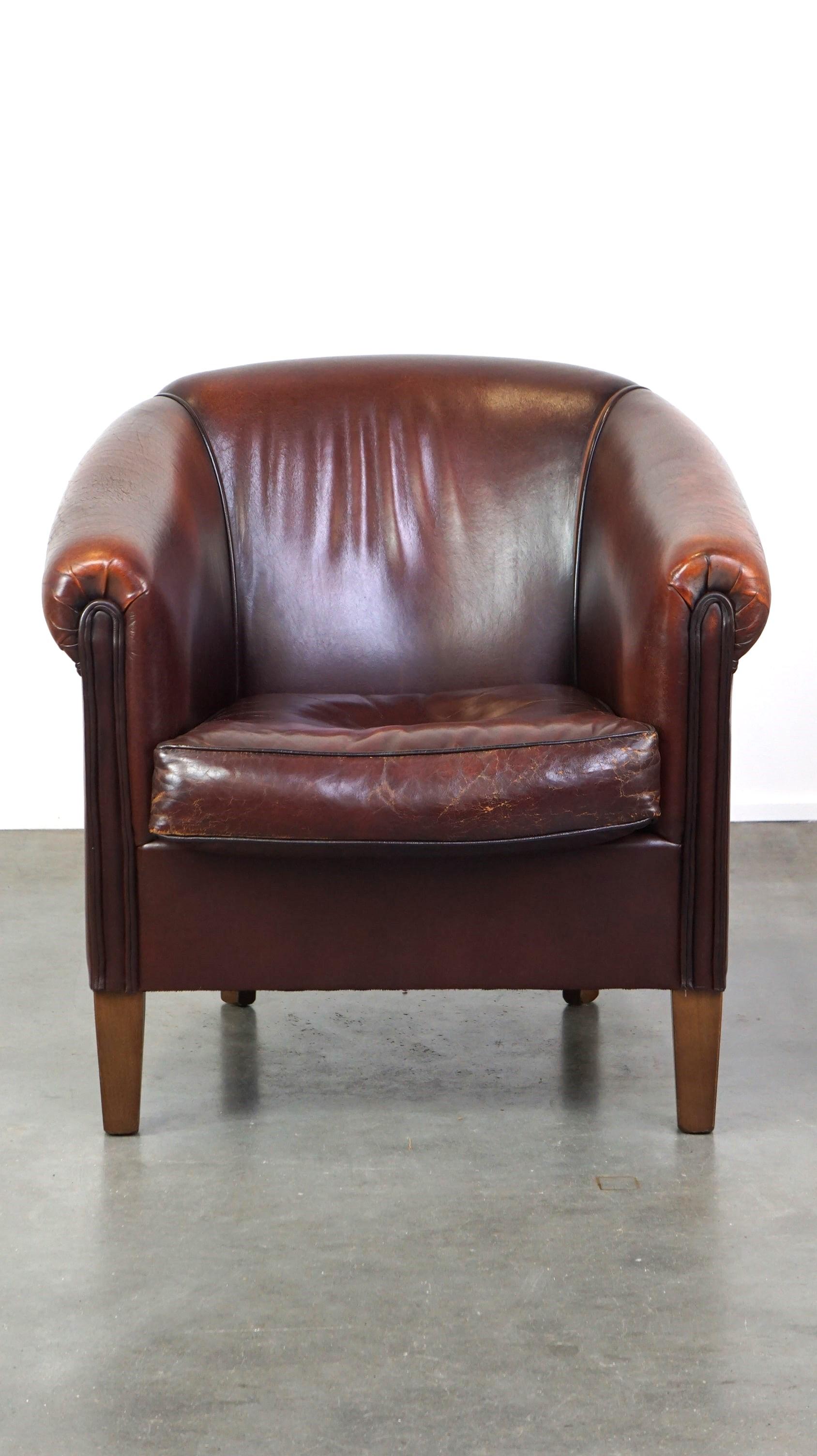 Dutch Nice sheepskin club chair with a beautiful patina For Sale