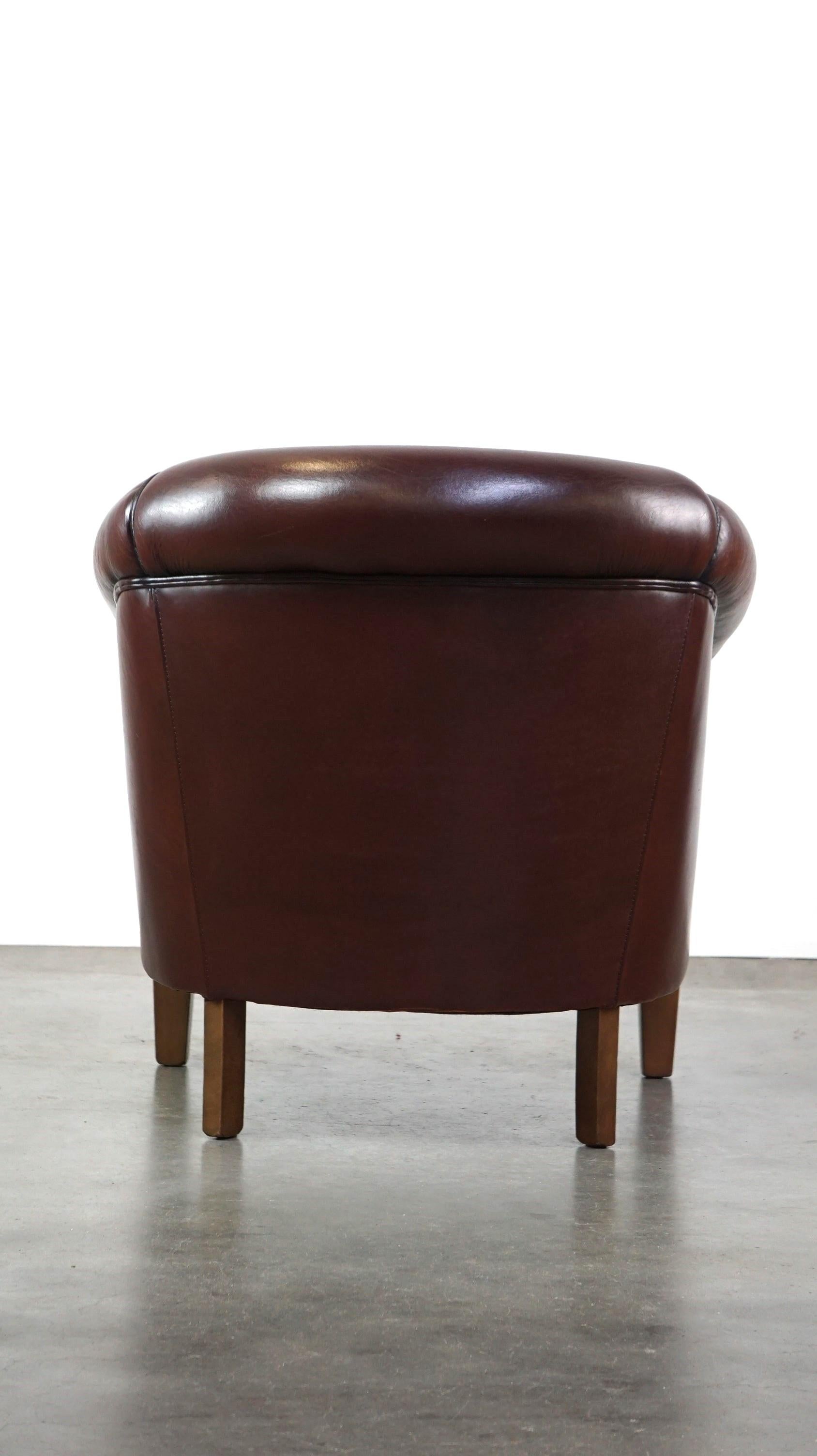 Nice sheepskin club chair with a beautiful patina In Fair Condition For Sale In Harderwijk, NL