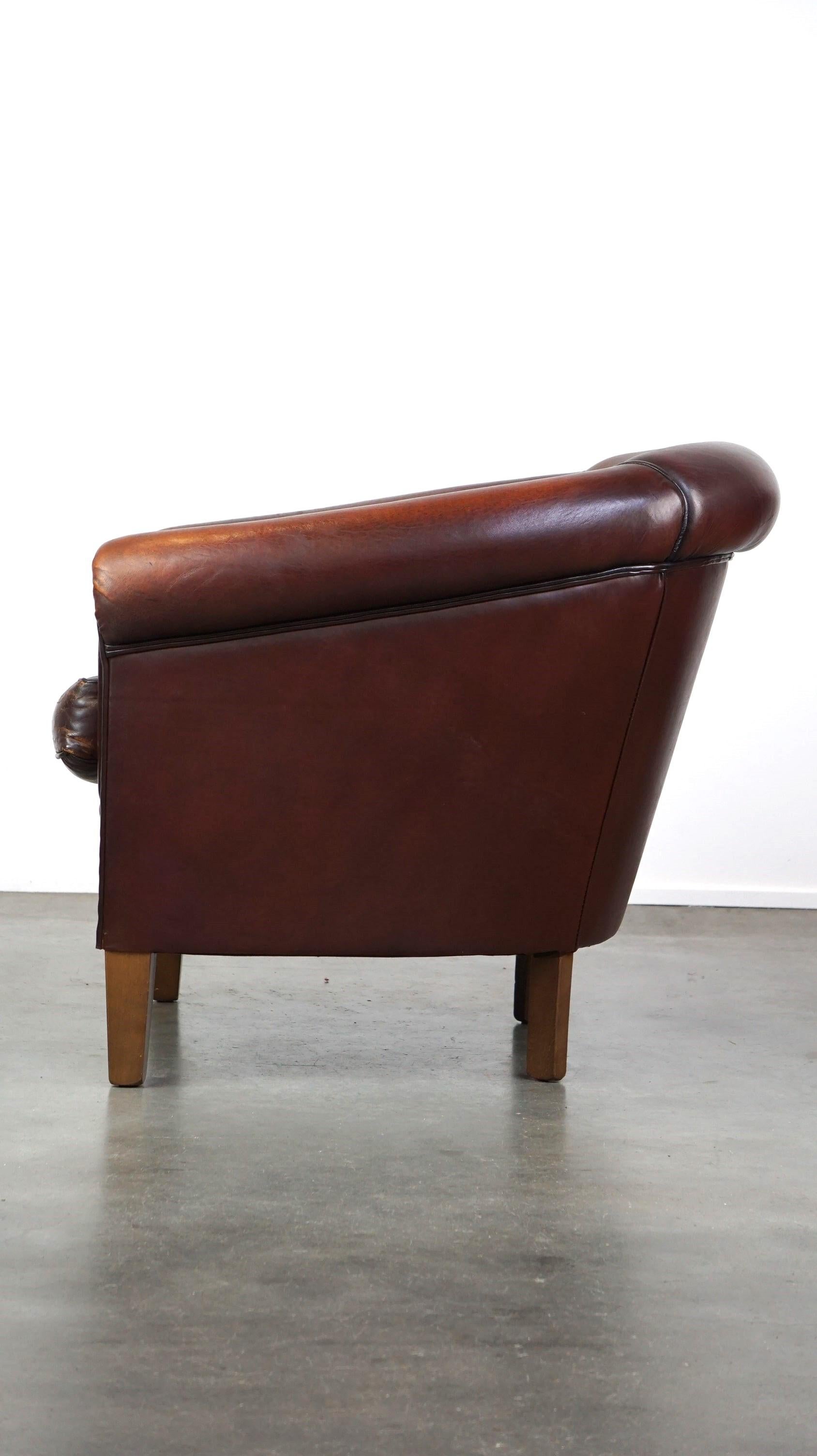 Contemporary Nice sheepskin club chair with a beautiful patina For Sale