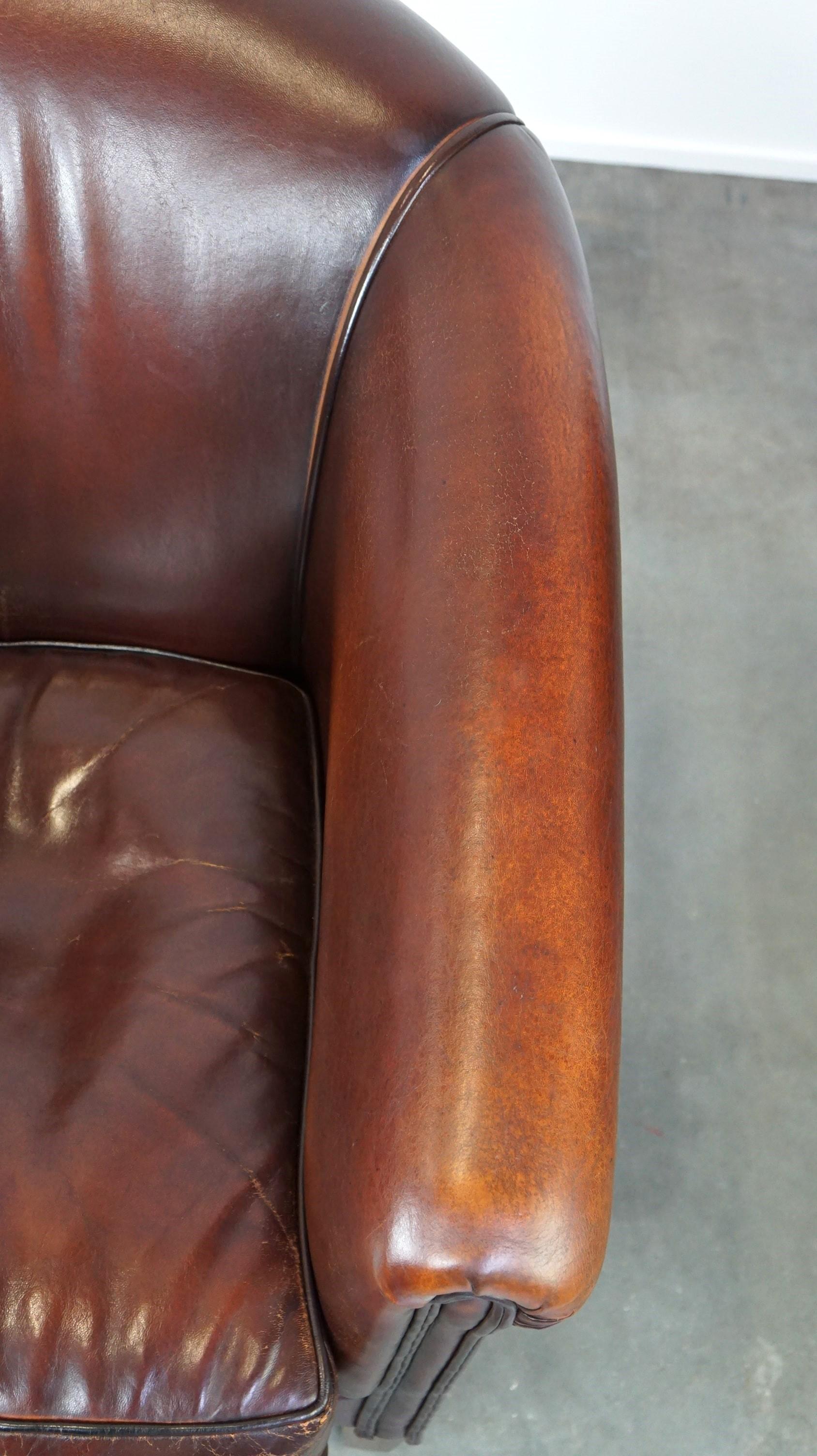 Nice sheepskin club chair with a beautiful patina For Sale 2