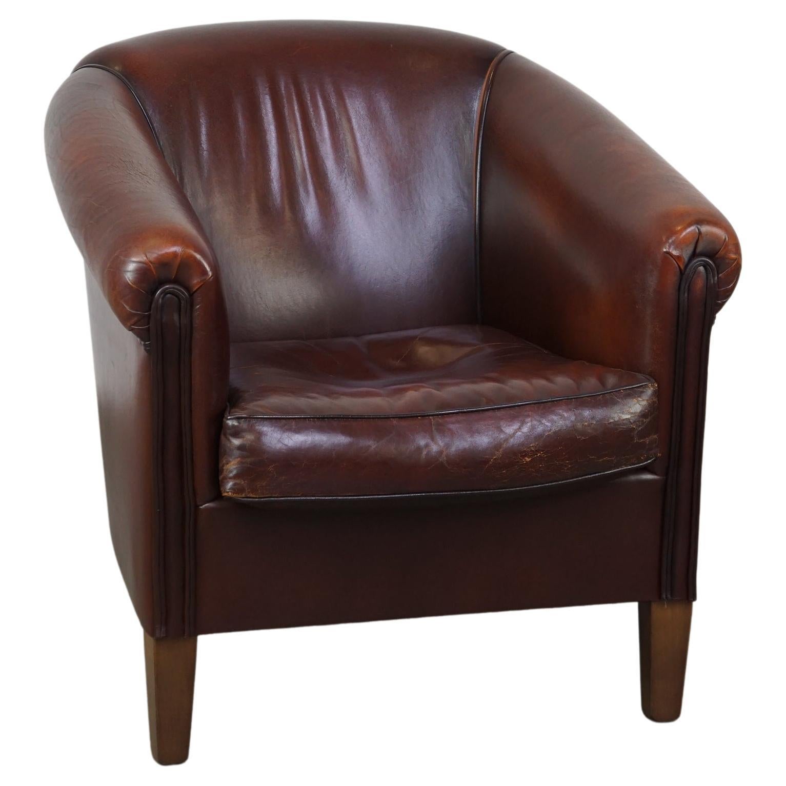Nice sheepskin club chair with a beautiful patina