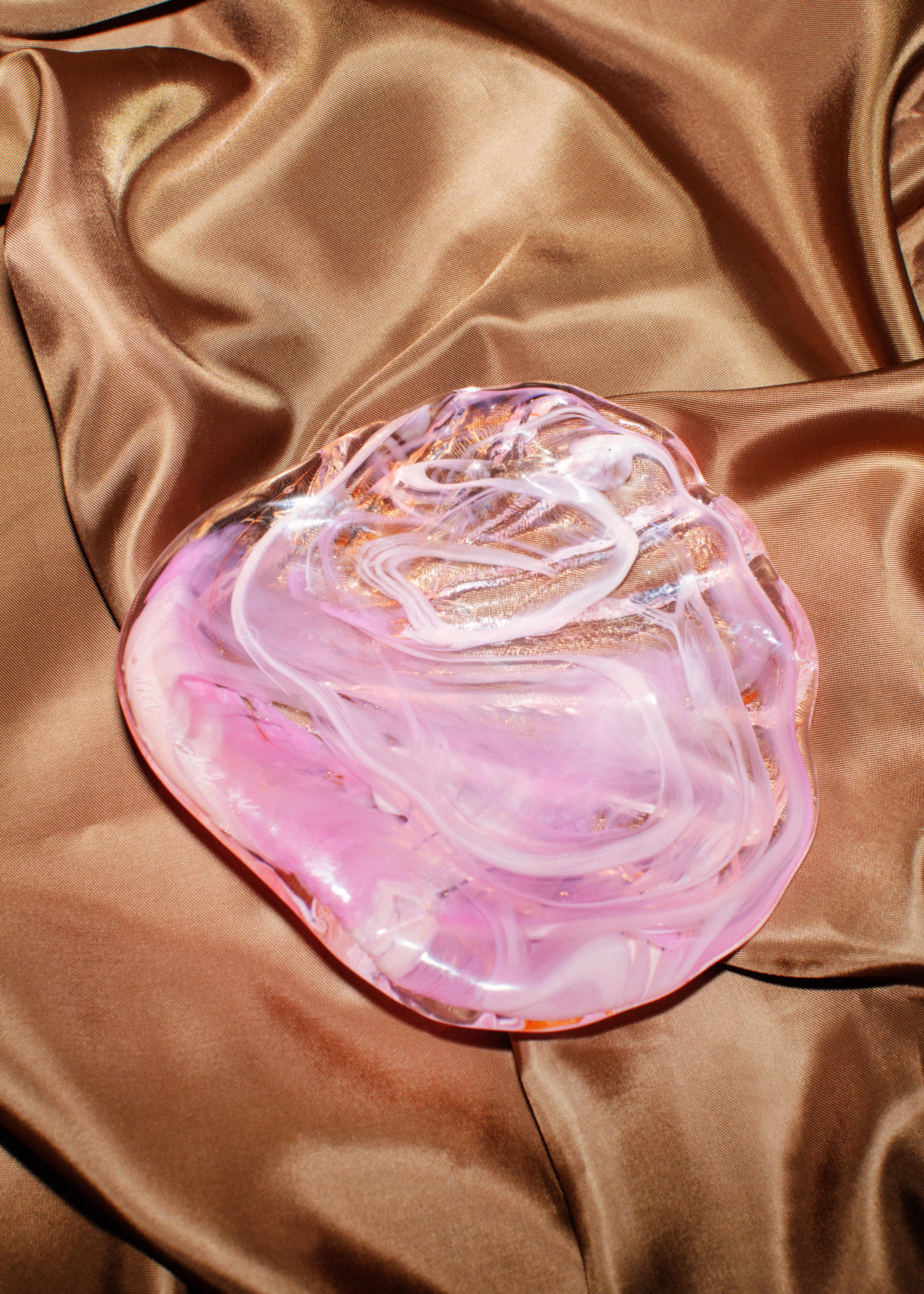 Hand molded small plate in glass, comes in different shades of pink and mixed colors. Beautiful in a table setting, for your jewelry or to serve something else delightful on! Choose between either of the three pieces in the image. 