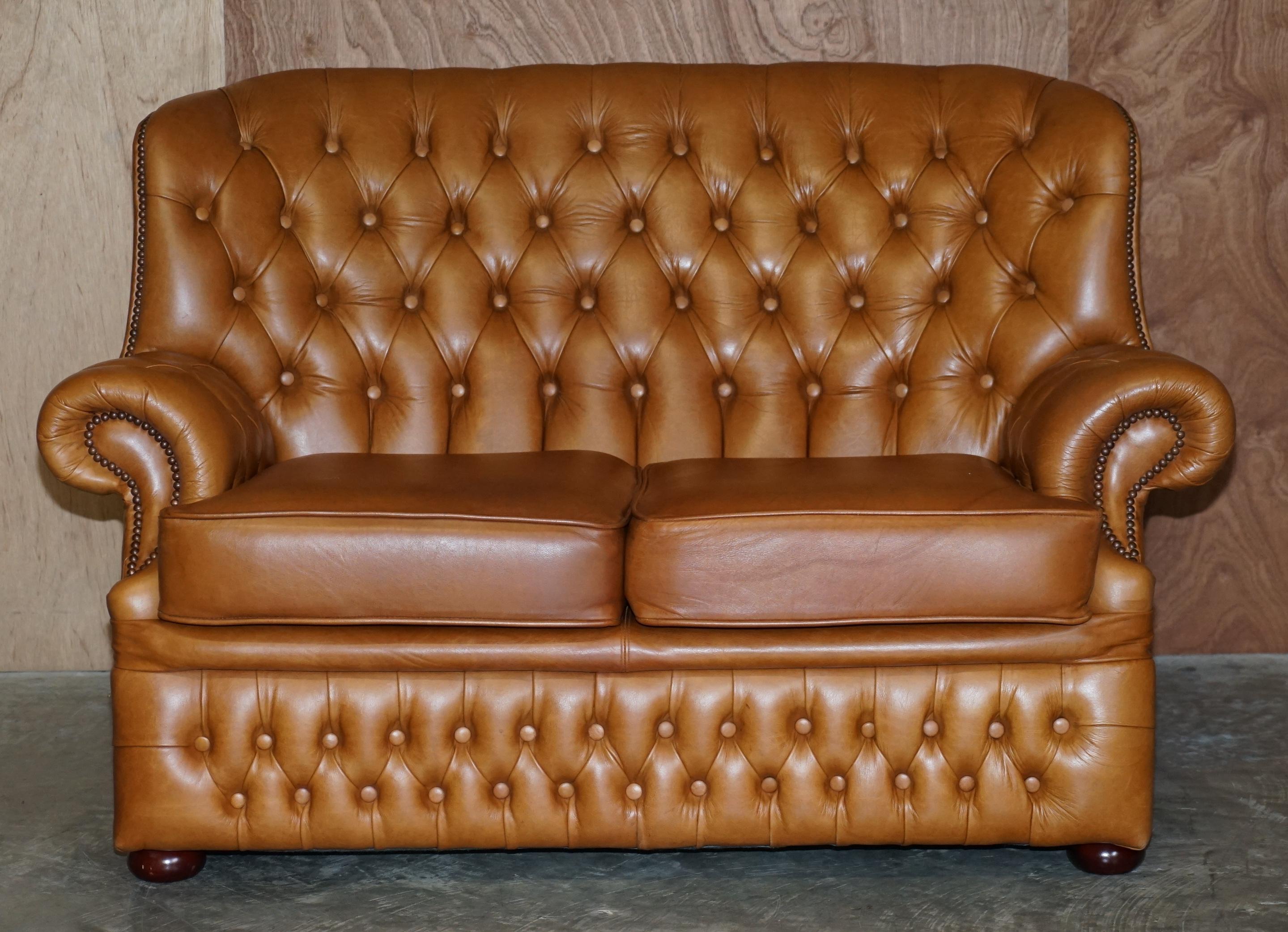 We are delighted to offer this very nice tan brown leather Chesterfield sofa

This is a very comfortable and good looking sofa, it has a high back so you can rest your whole back including head. The upholstery is very nice, it’s a biker tan