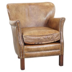 Nice, subtle cowhide armchair with a reversible kilim seat cushion
