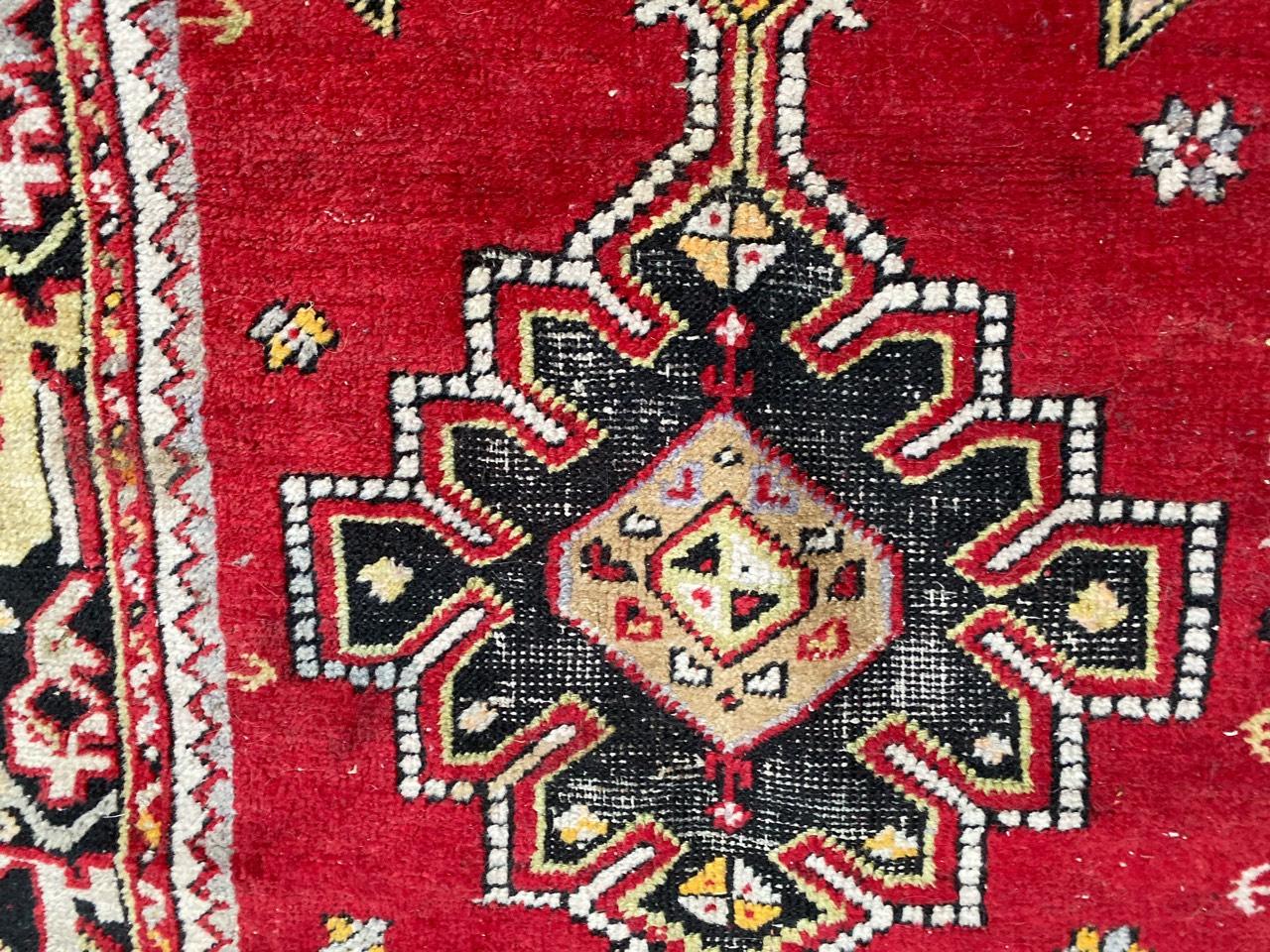 Very beautiful vintage Turkish rug with beautiful geometrical design and nice colors, with red, light purple, yellow and green, entirely hand knotted with wool velvet on wool foundation.