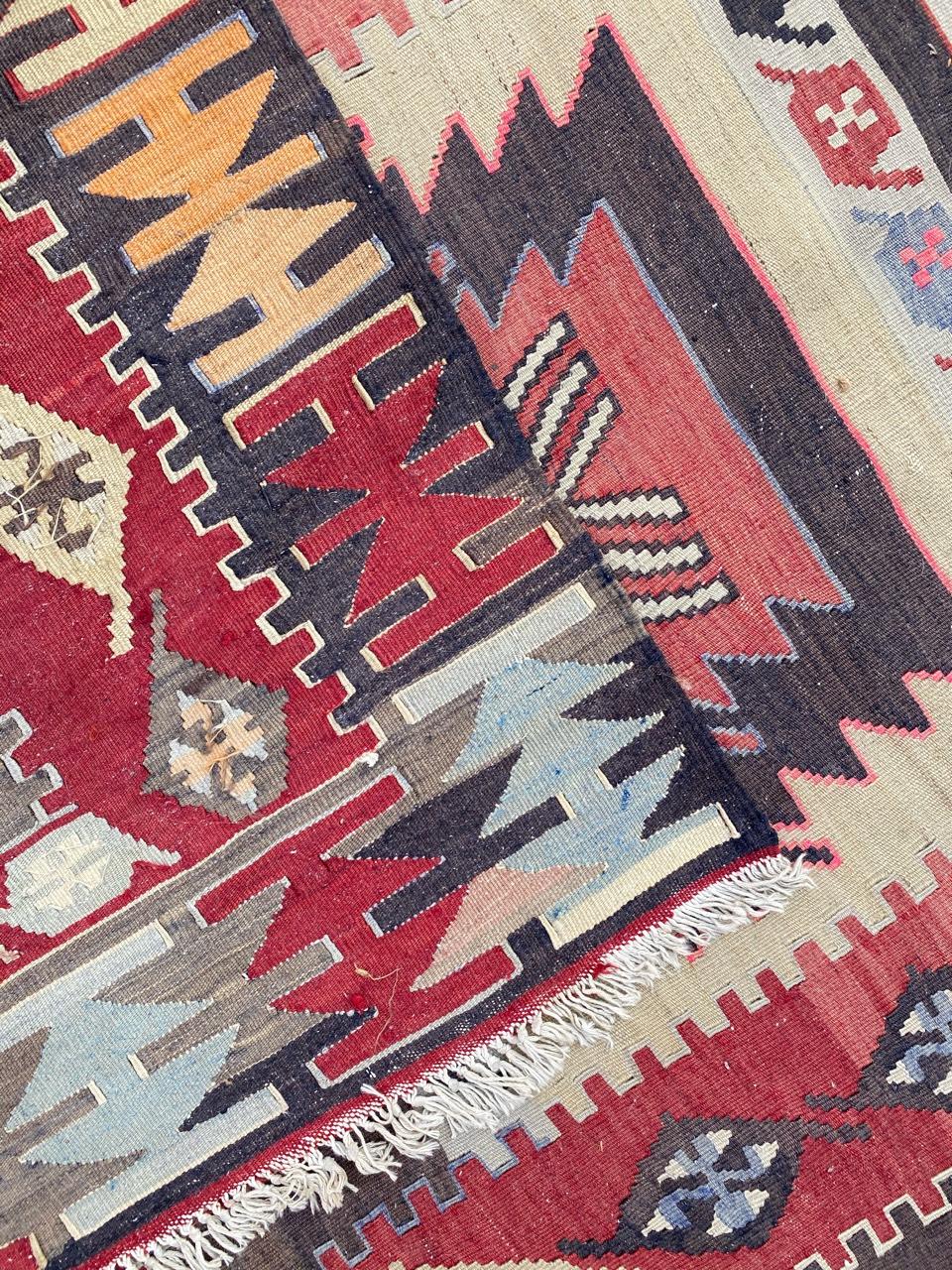 Very beautiful midcentury long Kilim, with a geometrical design and nice colors with red, blue, yellow, pink and purple, entirely handwoven with wool on cotton.
