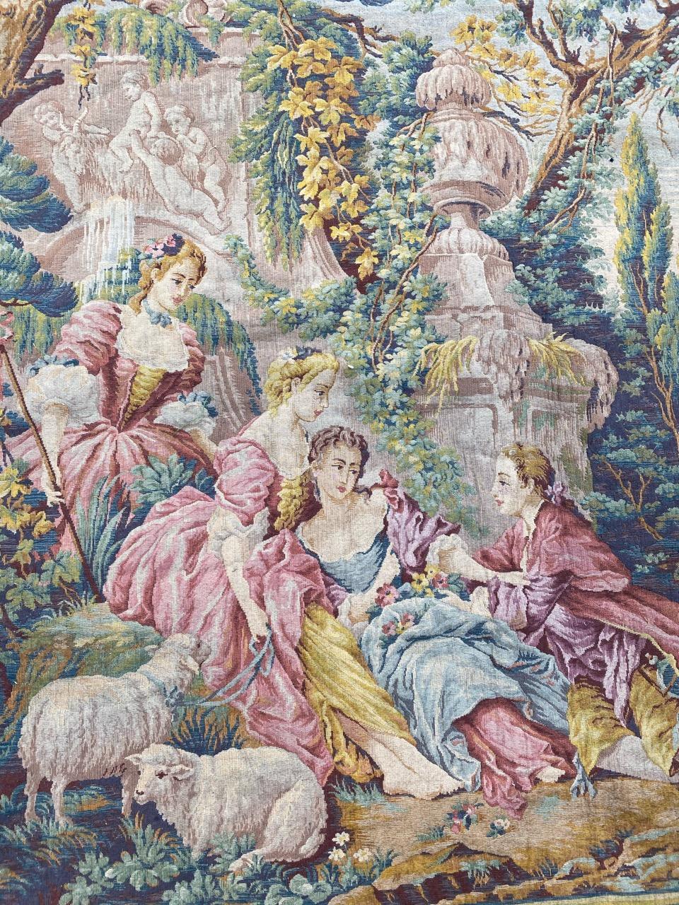 Discover the elegance of this midcentury Jaquar tapestry, a mechanical masterpiece reminiscent of François Boucher's style. Adorned with a romantic design, vibrant hues of blue, yellow, green, pink, and red create a captivating scene of pastoral