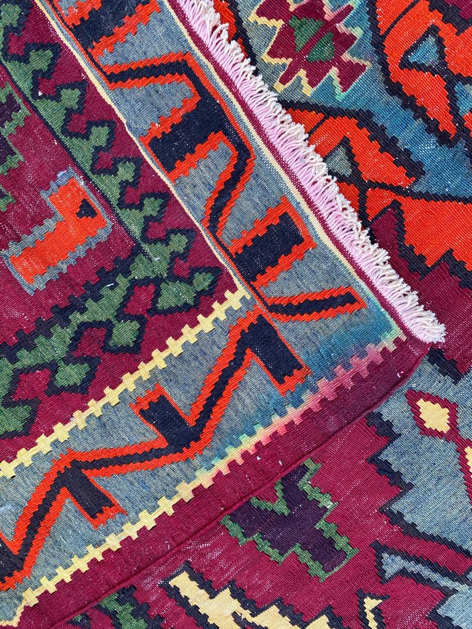 Beautiful long Anatolian Kilim with nice geometrical design and nice colors with purple, pink, blue, yellow, green and orange, entirely handwoven with wool on cotton.