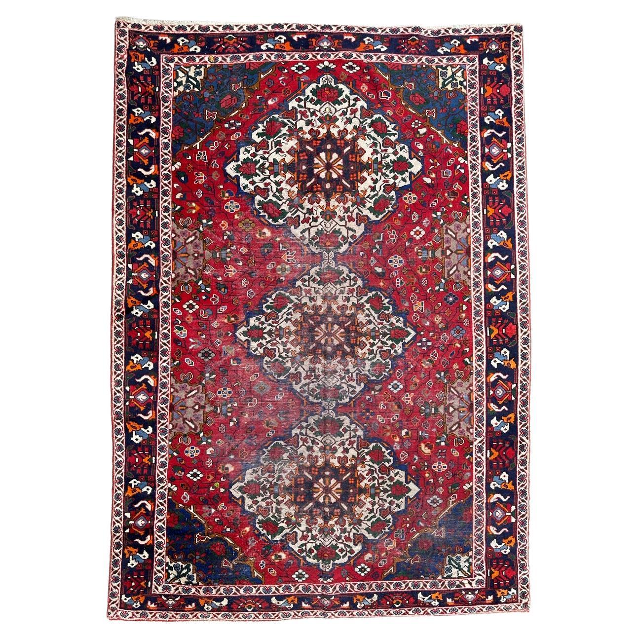 Nice vintage distressed Bakhtiar rug For Sale