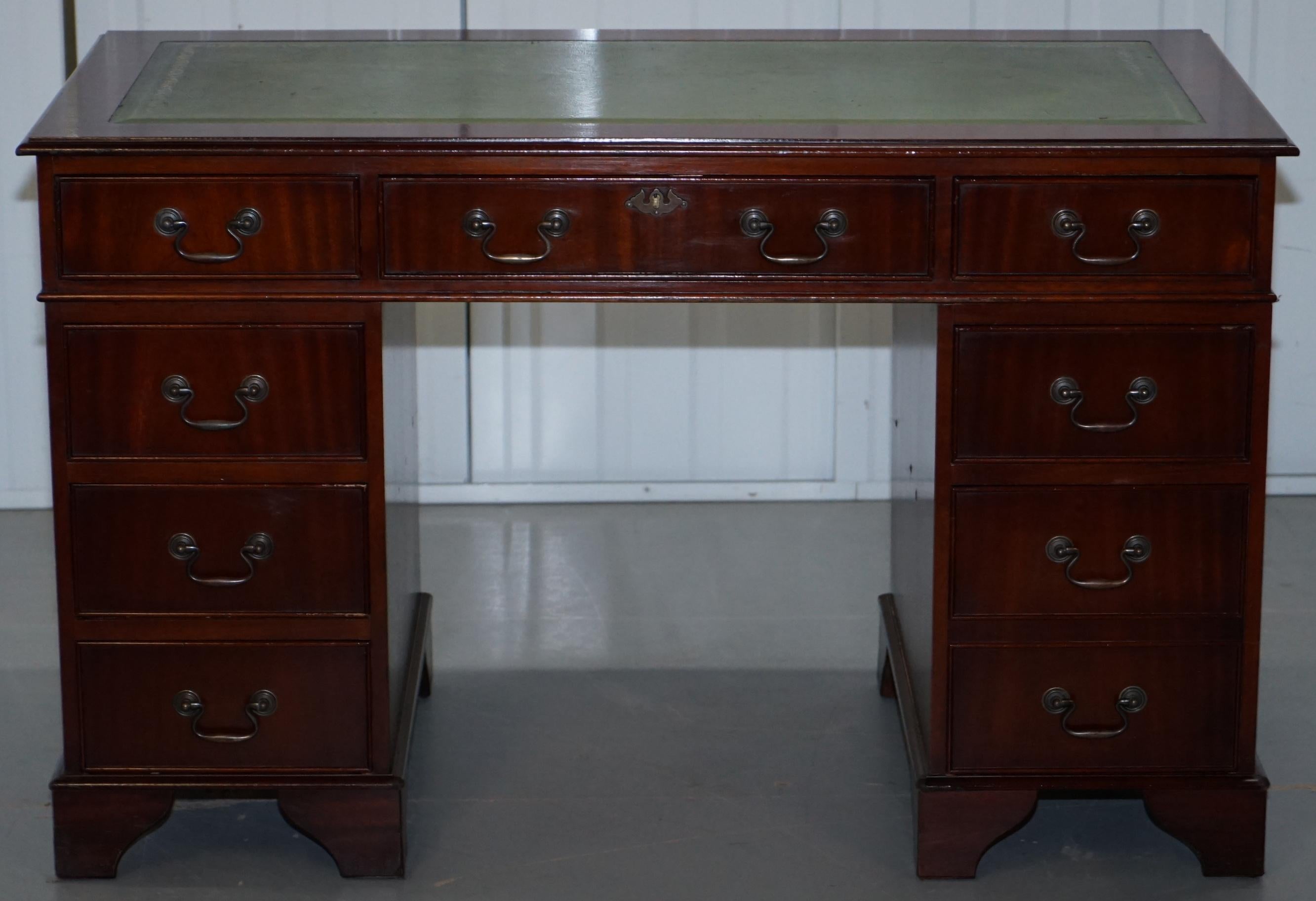 We are delighted to offer for sale this vintage twin pedestal partner desk finished in mahogany and with a green leather top

A very good looking and well made desk with a lovely timber patina, the desk splits into three easy to transport