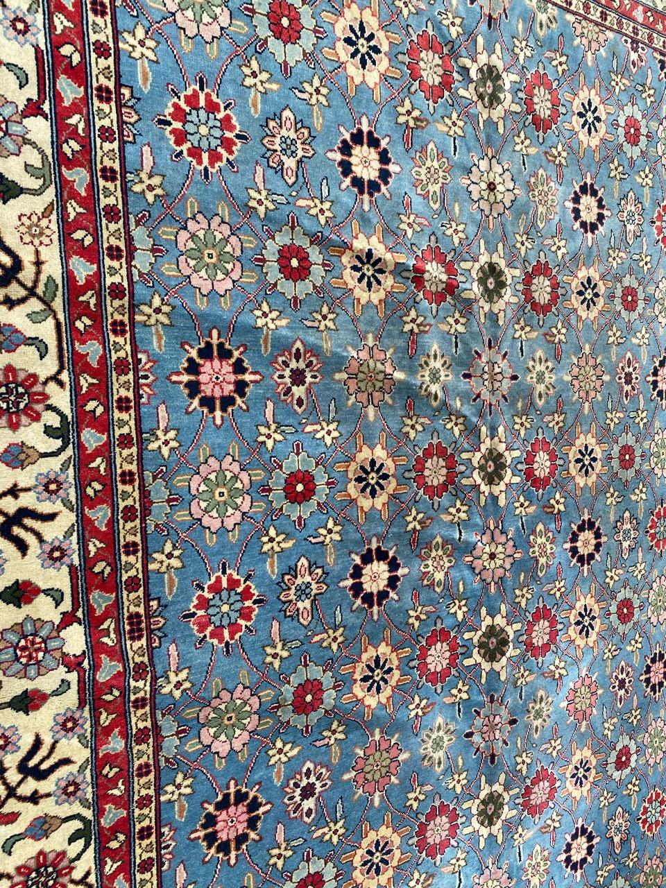 Nice large carpet from Transylvania, with floral Persian Varamin design, and pretty colors on a blue background, with pink, entirely hand-knotted in woolen velvet on cotton foundation.