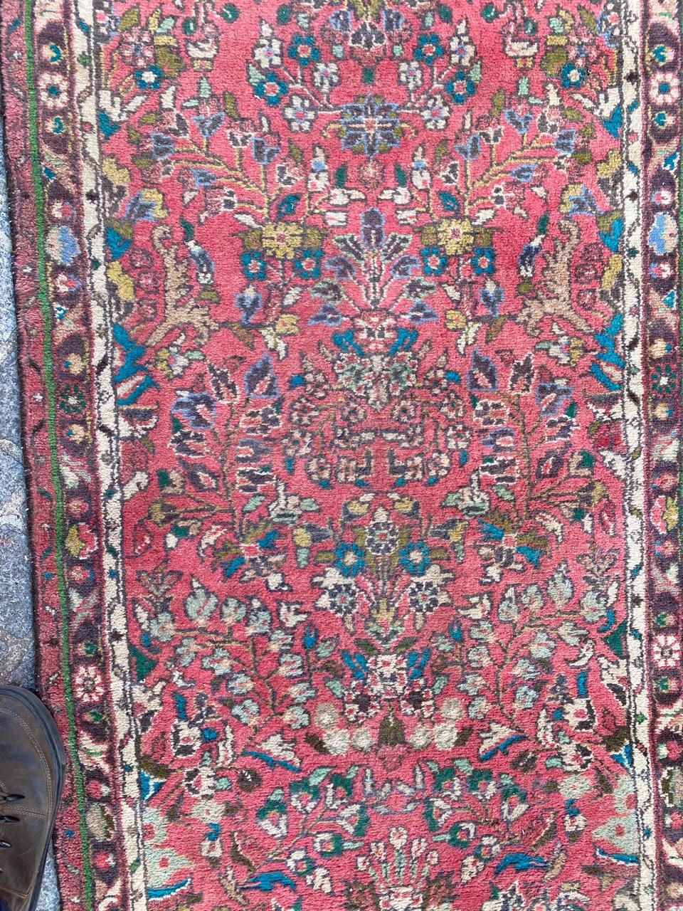 Beautiful floral design runner with beautiful colors with a pink field color, entirely hand knotted with wool velvet on cotton foundation.