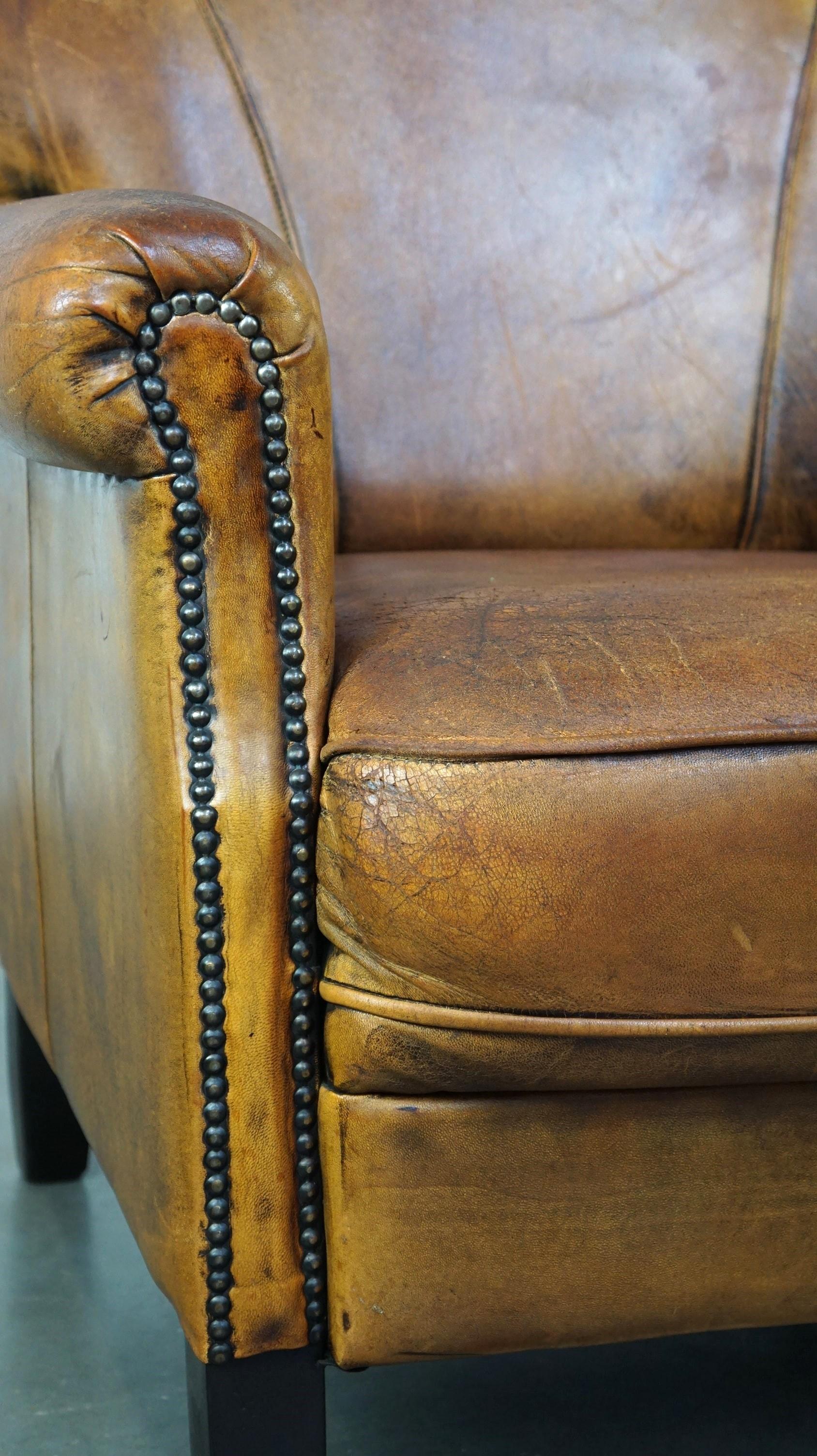 Nice vintage sheepskin armchair with beautiful colors and a comfortable seat For Sale 4