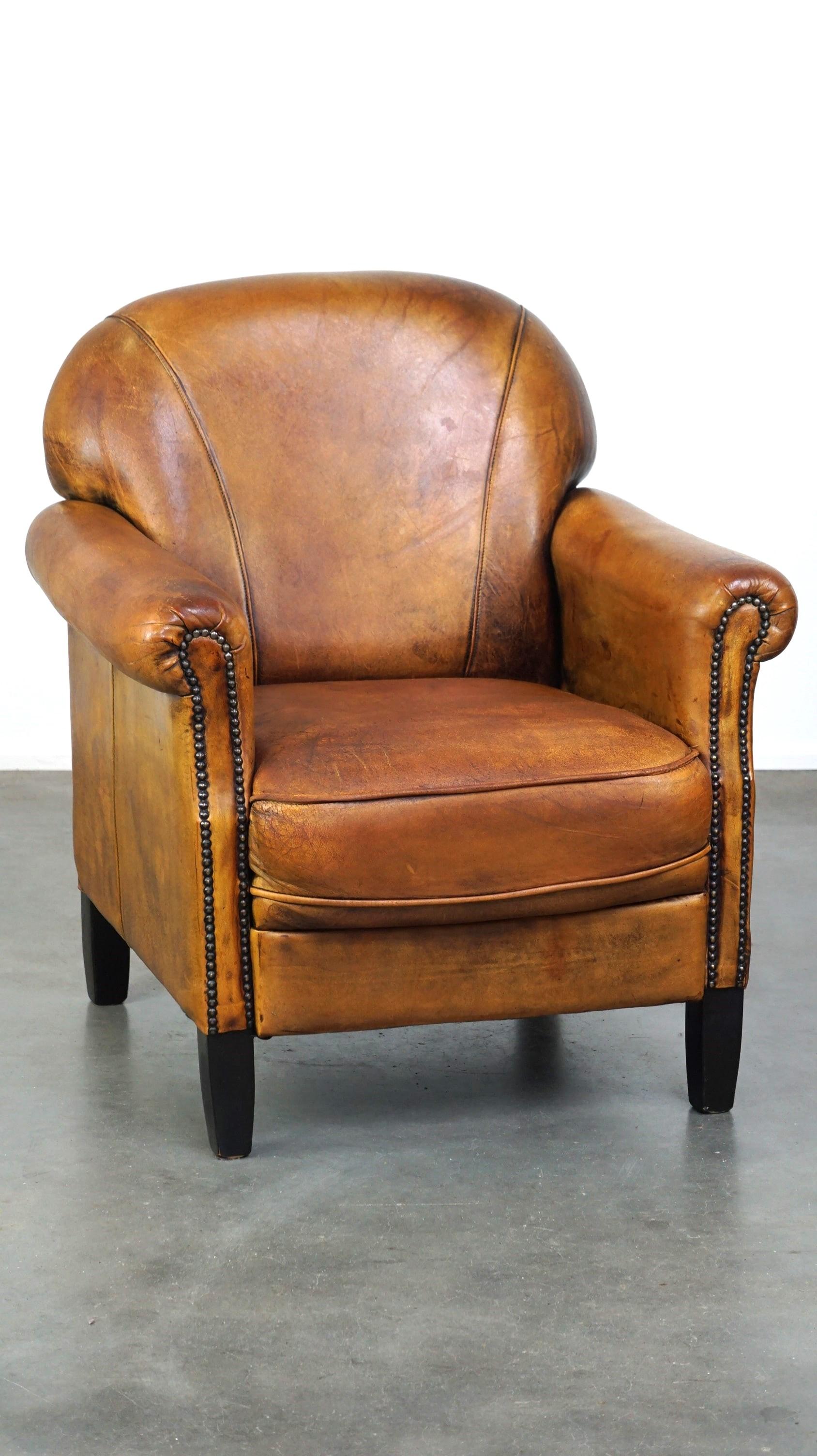 Dutch Nice vintage sheepskin armchair with beautiful colors and a comfortable seat For Sale