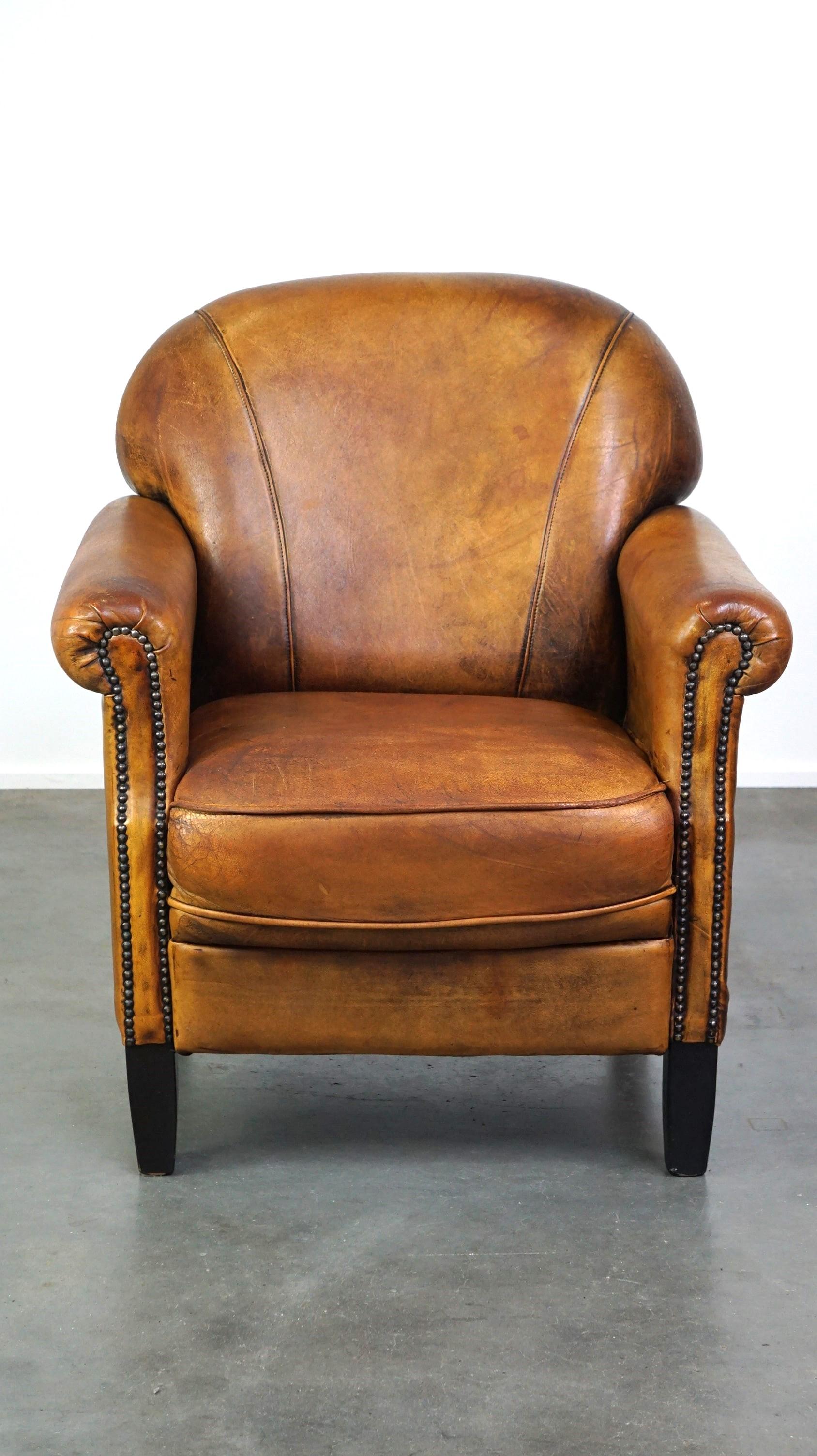 Hand-Crafted Nice vintage sheepskin armchair with beautiful colors and a comfortable seat For Sale