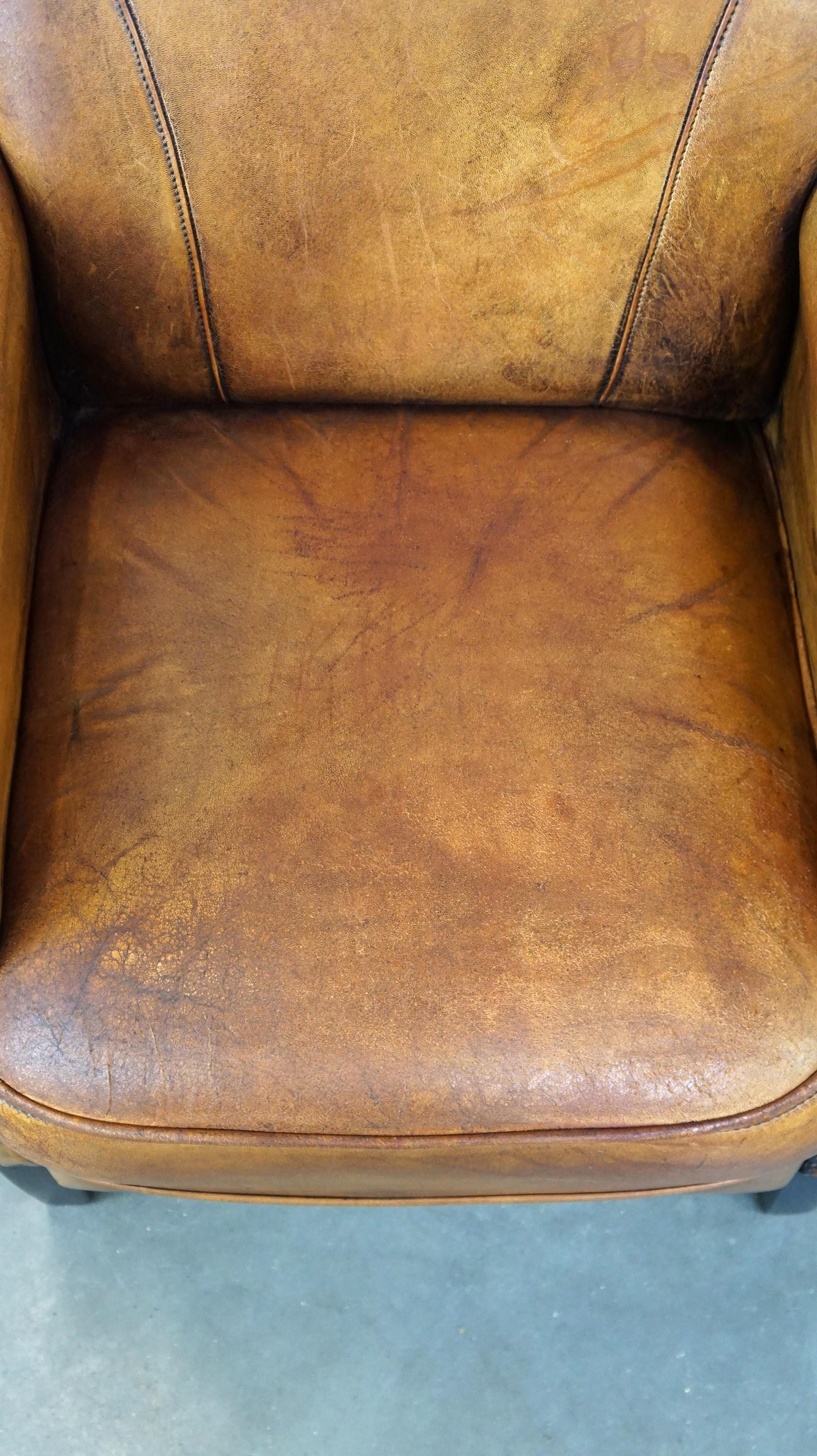 Nice vintage sheepskin armchair with beautiful colors and a comfortable seat For Sale 1