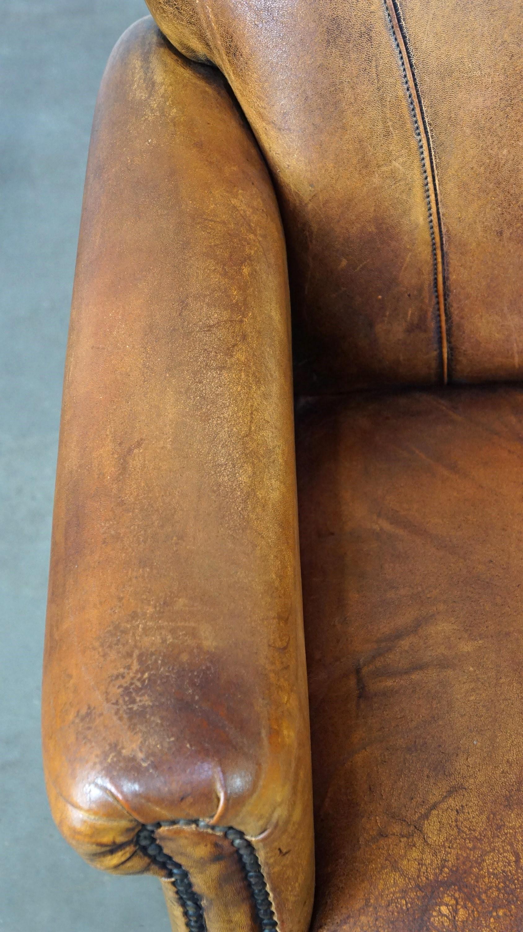 Nice vintage sheepskin armchair with beautiful colors and a comfortable seat For Sale 2