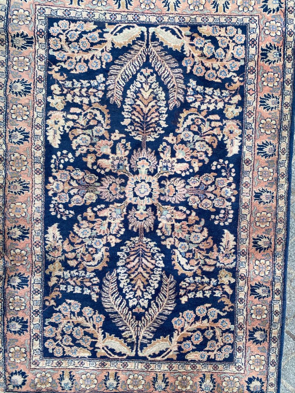 Beautiful mid century rug with a floral Kirman design and beautiful colors with blue field, entirely hand knotted with wool velvet on cotton foundation.