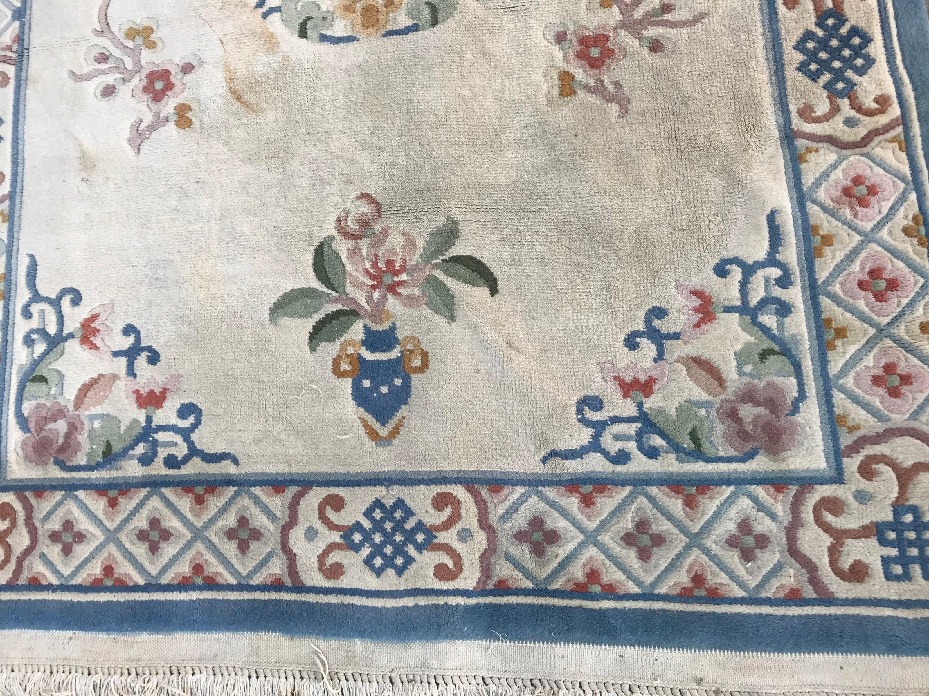 Beautiful late 20th century Chinese rug with nice Chinese Art Deco design and light colors with yellow, green, blue and pink, entirely hand knotted with wool velvet on cotton foundation.