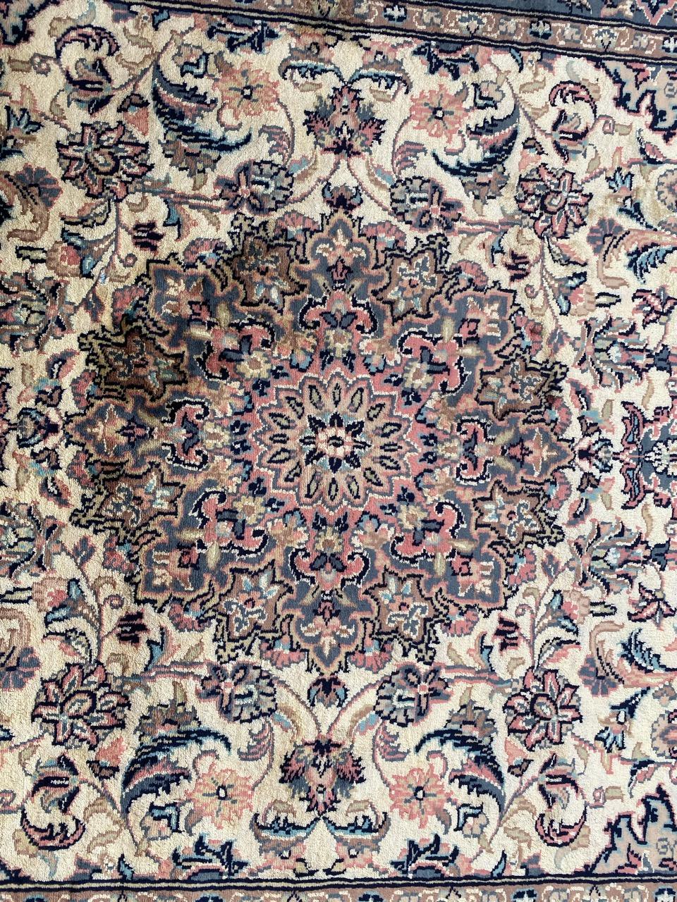 Beautiful late 20th century rug with nice floral design and beautiful light colors, entirely and finely hand knotted with wool and silk velvet on cotton foundation.