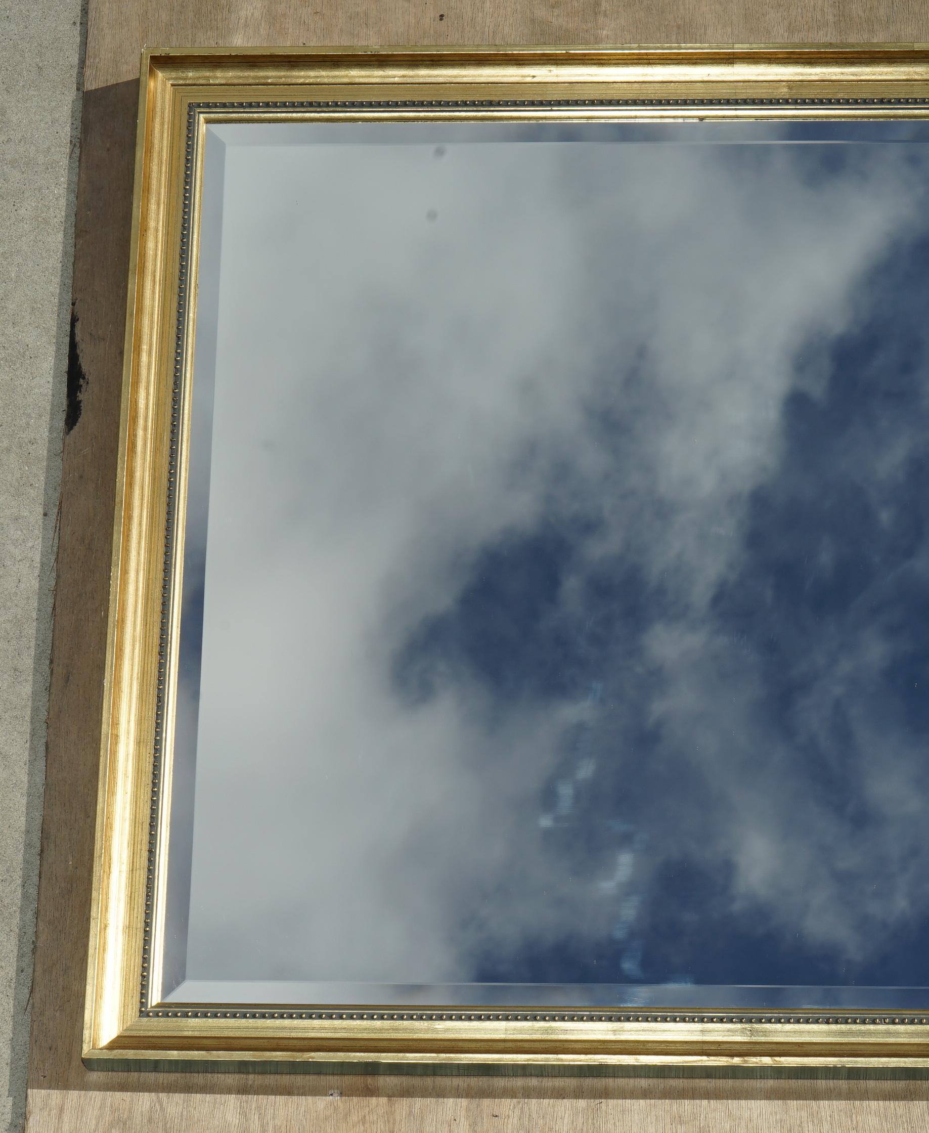 We are delighted to offer for sale this very nice modern Giltwood wall mirror with bevelled edge glass plate

A very good looking and decorative mirror, it can be used in multiple locations, bedroom, hallway and so on

You can see the sky in the