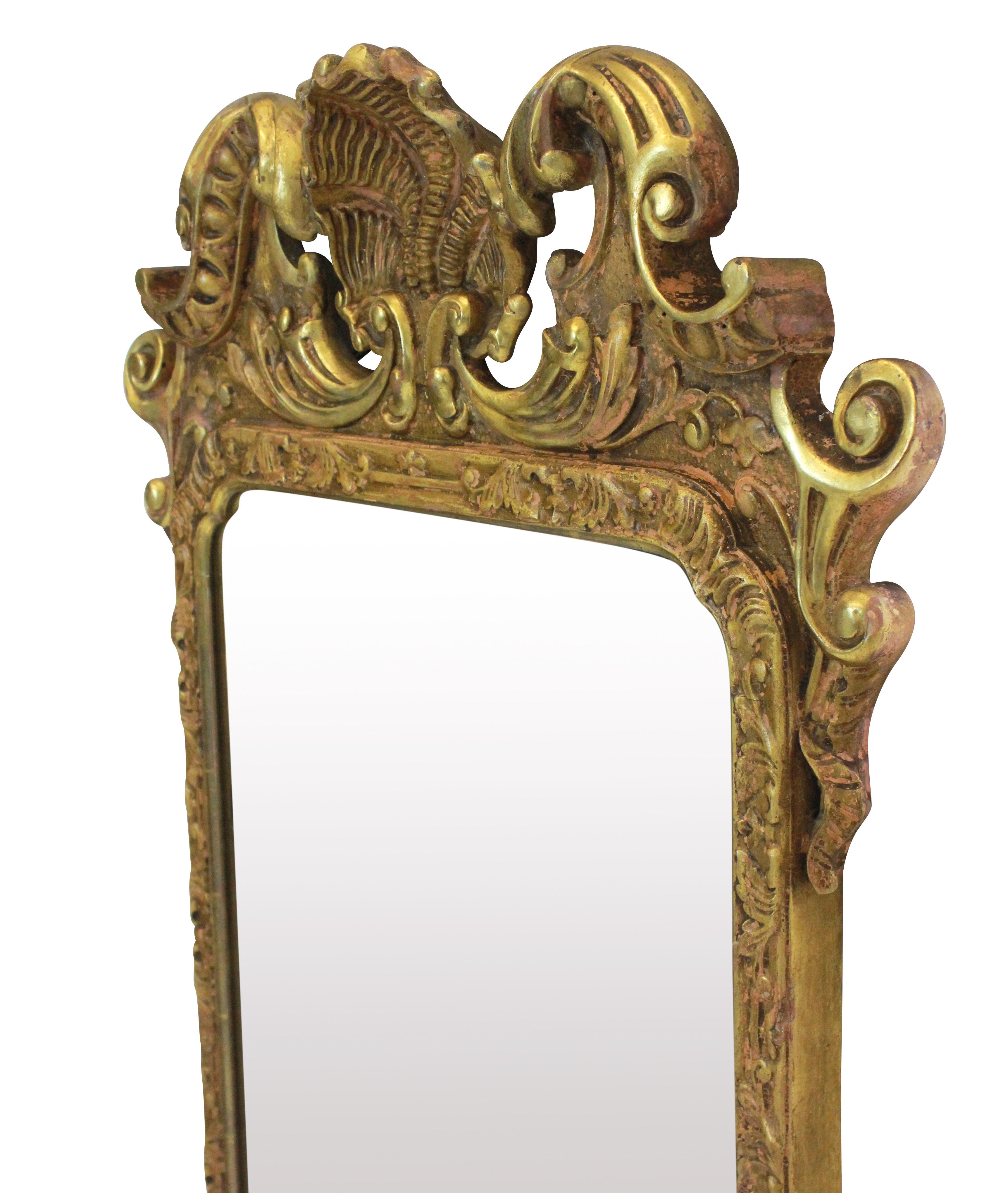 A George III carved and water gilded mirror with a good patina.

 