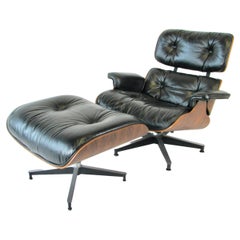 Eames fauteuil de salon en bois de rose joliment grainé pour Herman Miller 670 671 avec pouf