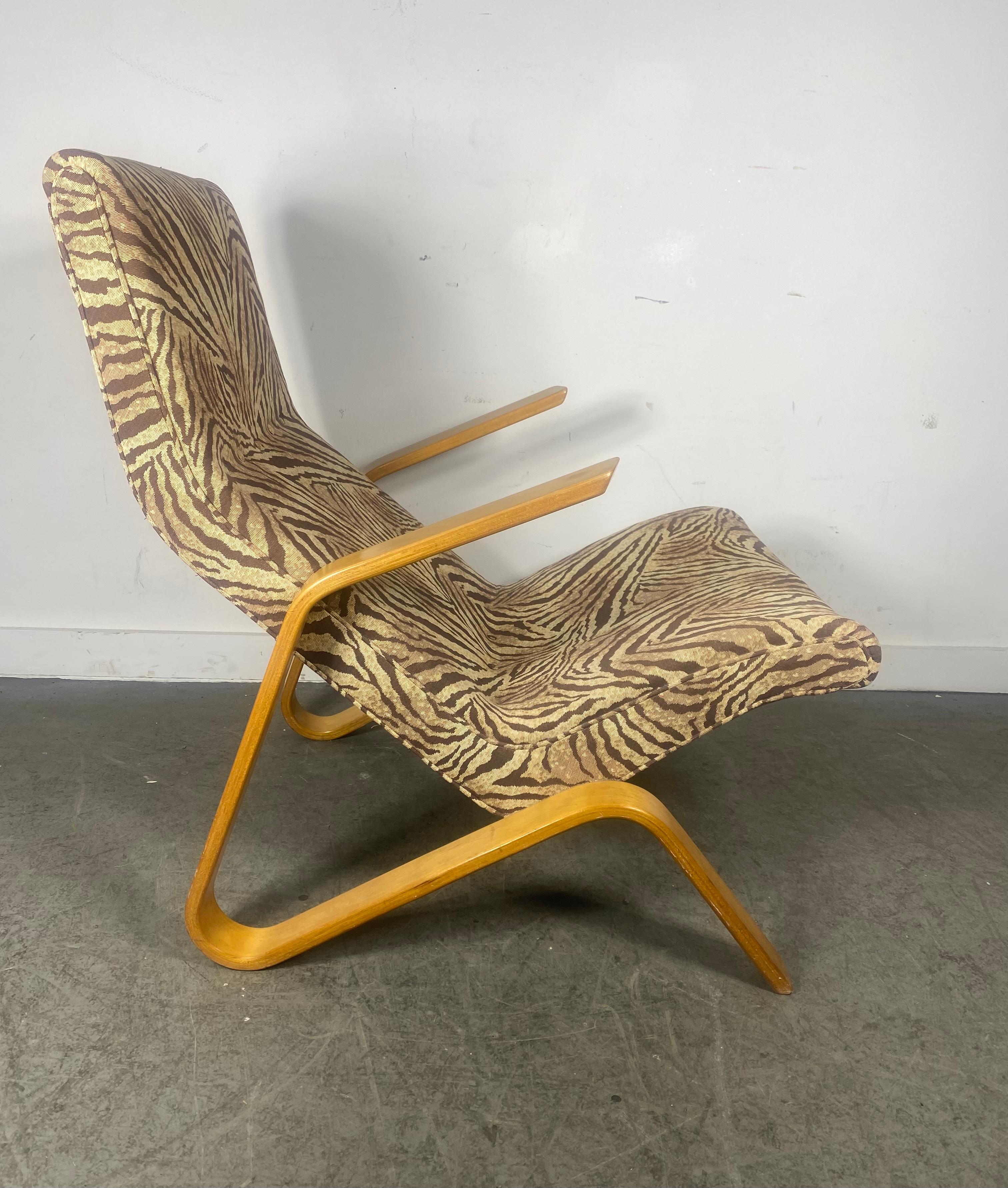 Grasshopper Chair by Eero Saarinen ..Nice 1970s example,, properly re-upholstered.. Retains original birch laminate plywood finish,, Wonderful patina,, great color..Extremely comfortable.. Hand delivery avail to New York City or anywhere en route