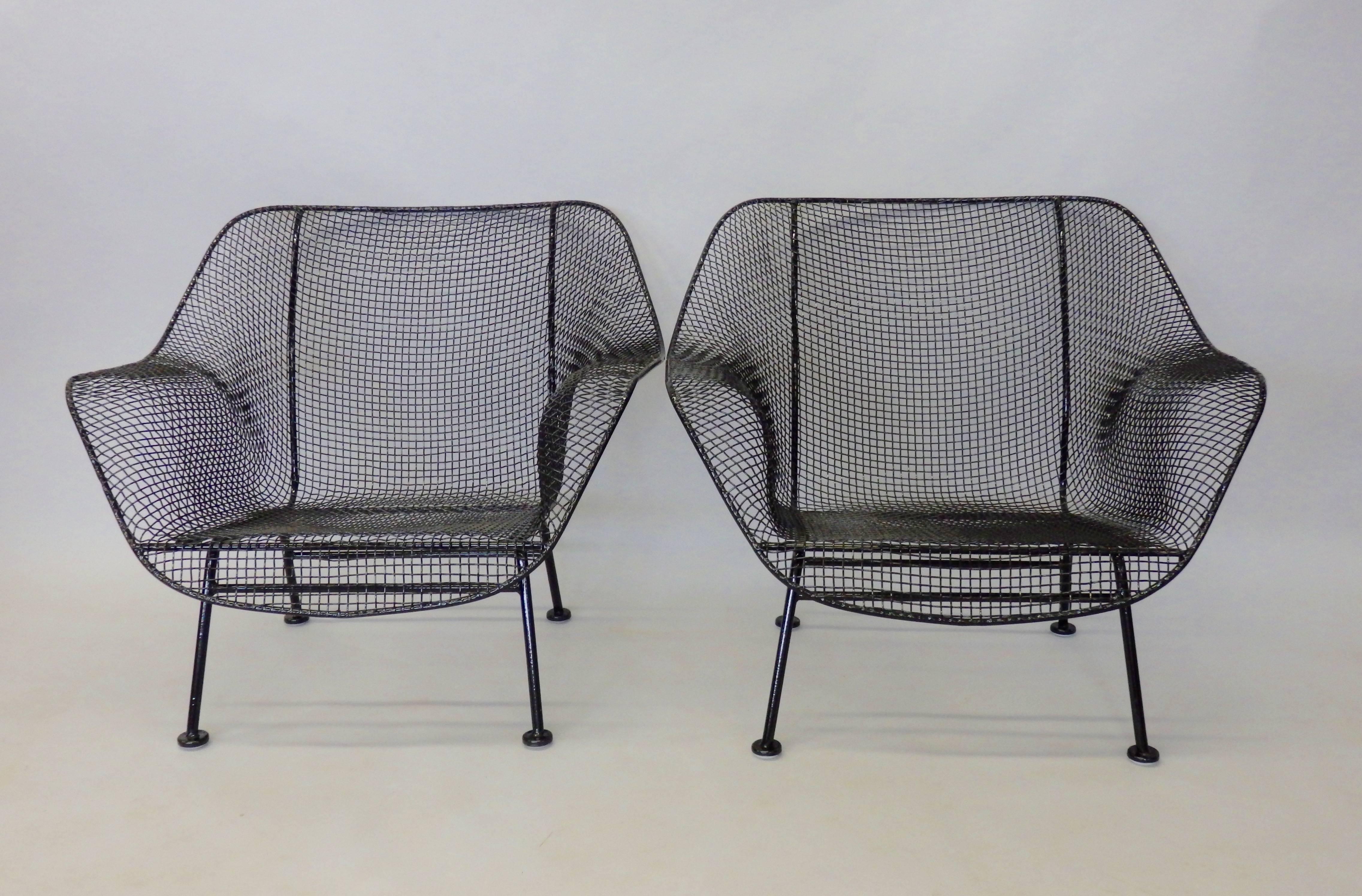 Pair of Woodard wide lounge chairs. Recently powder coated gloss black with fresh foot glide installed.