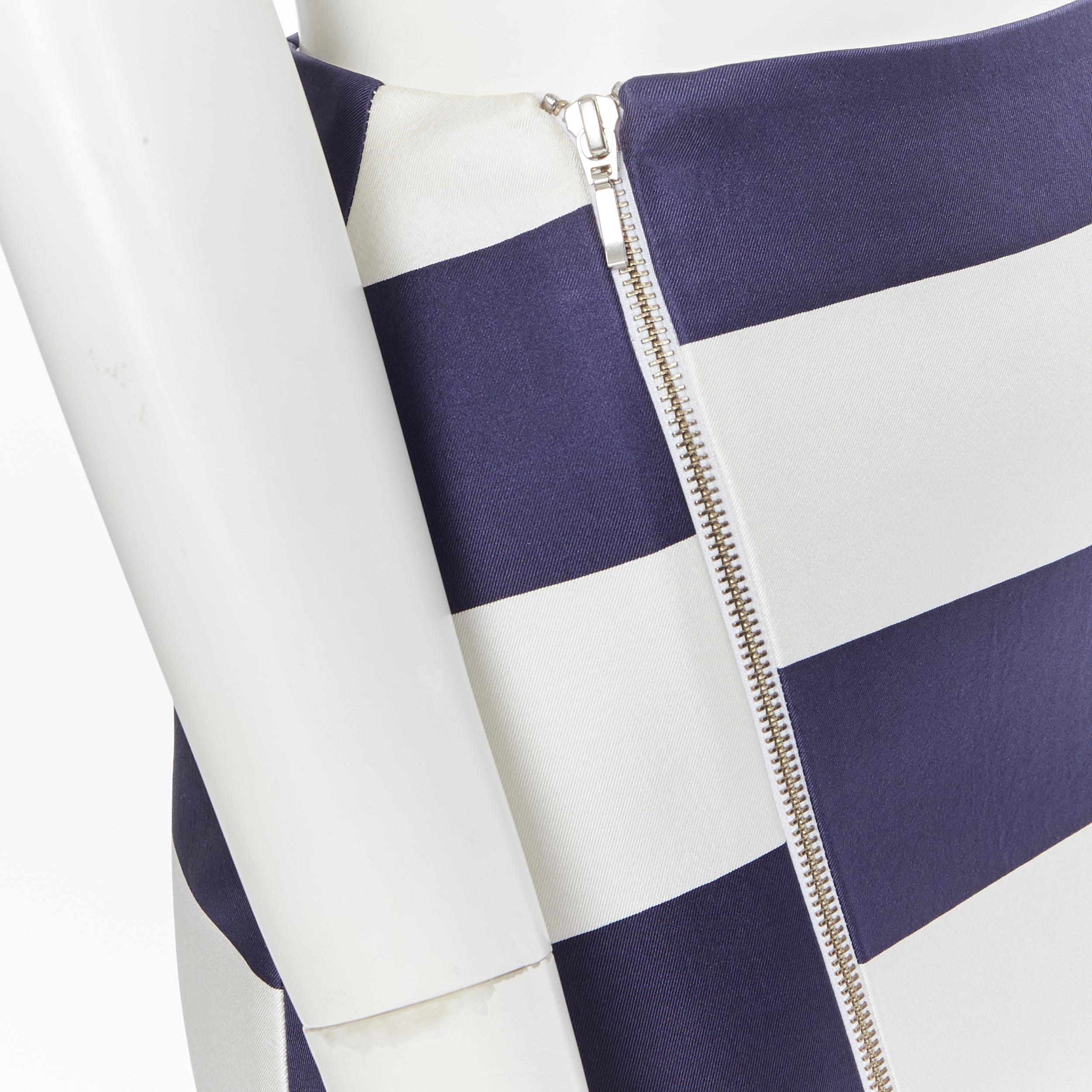 NICHOLAS 100% silk navy white striped asymmetric zip pencil skirt US2
Brand: Nicholas
Model Name / Style: Pencil skirt
Material: Silk
Color: Navy and white
Pattern: Striped
Closure: Zip
Extra Detail: Silver-tone hardware. Vent at front. Pencil