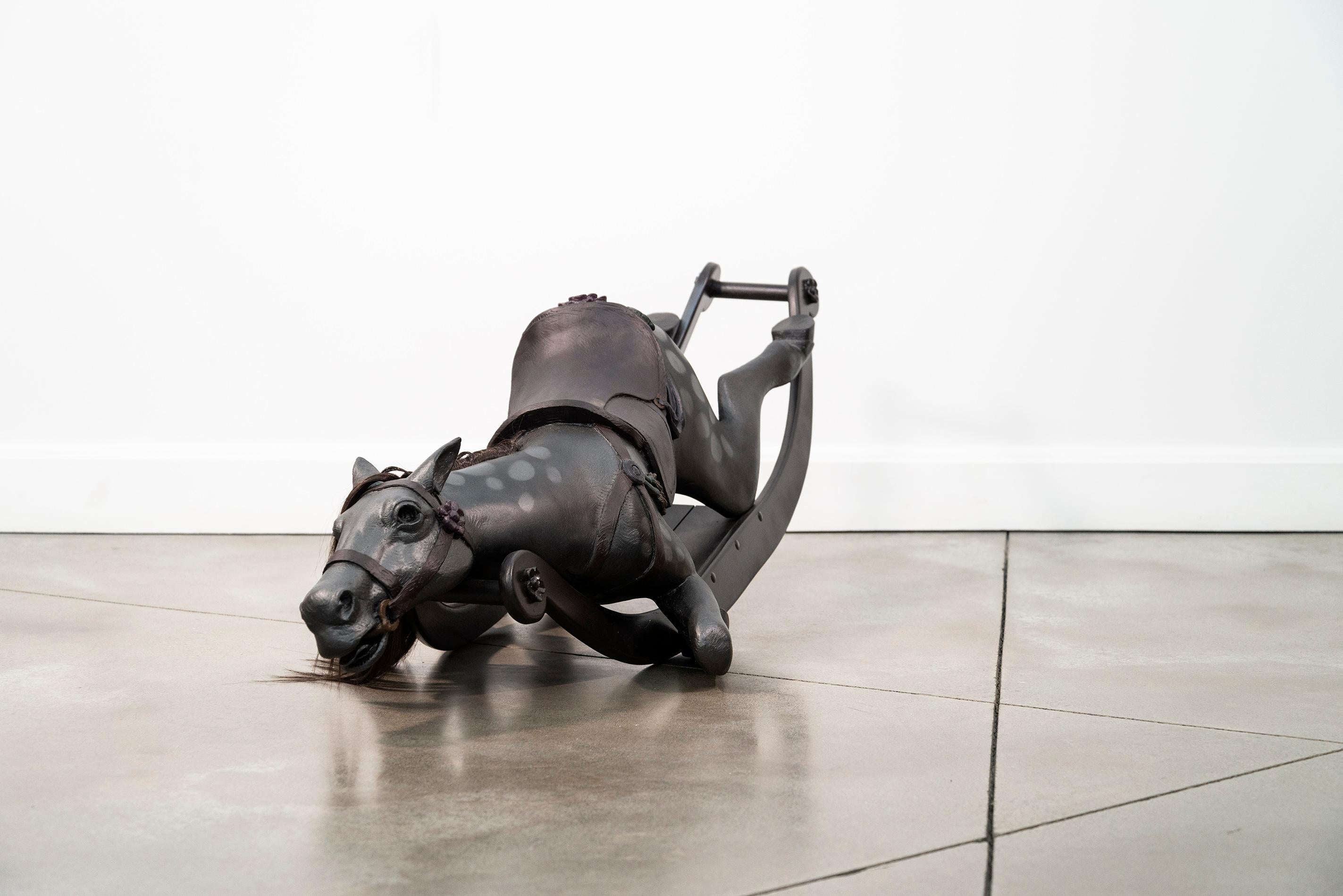 It is a powerful image—at once compelling and provocative—an old-fashioned rocking horse, collapsed. This is the work of Nicholas Crombach.

The Kingston based artist creates sculptures from a variety of cast mediums including bronze and resin. This
