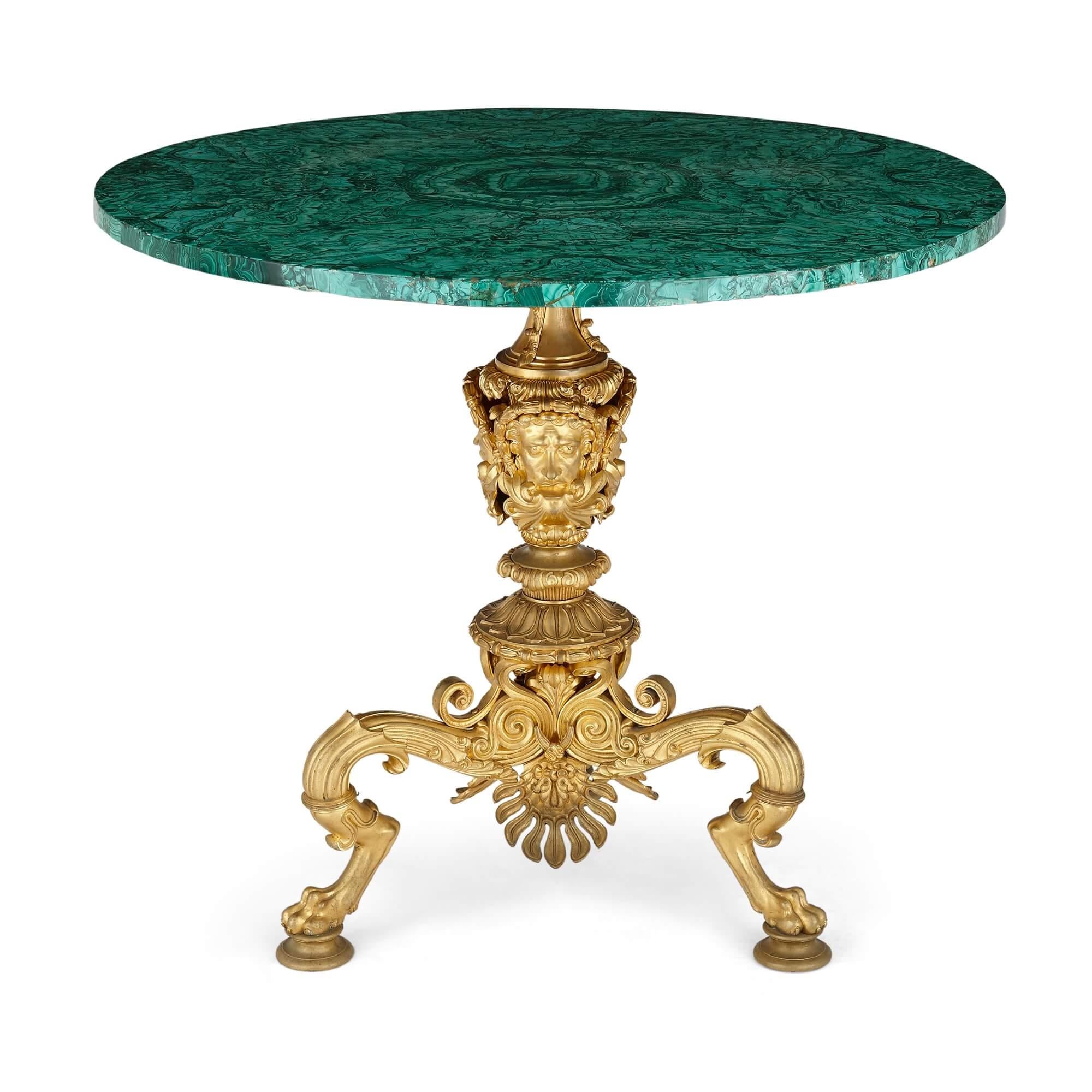 Nicholas I period Russian malachite side table with gilt bronze base
Russian c. 1840
Measures: Height 77cm, diameter 89cm

This is a truly exceptional piece, representing some of the most extravagant craftsmanship of the early 19th Century in