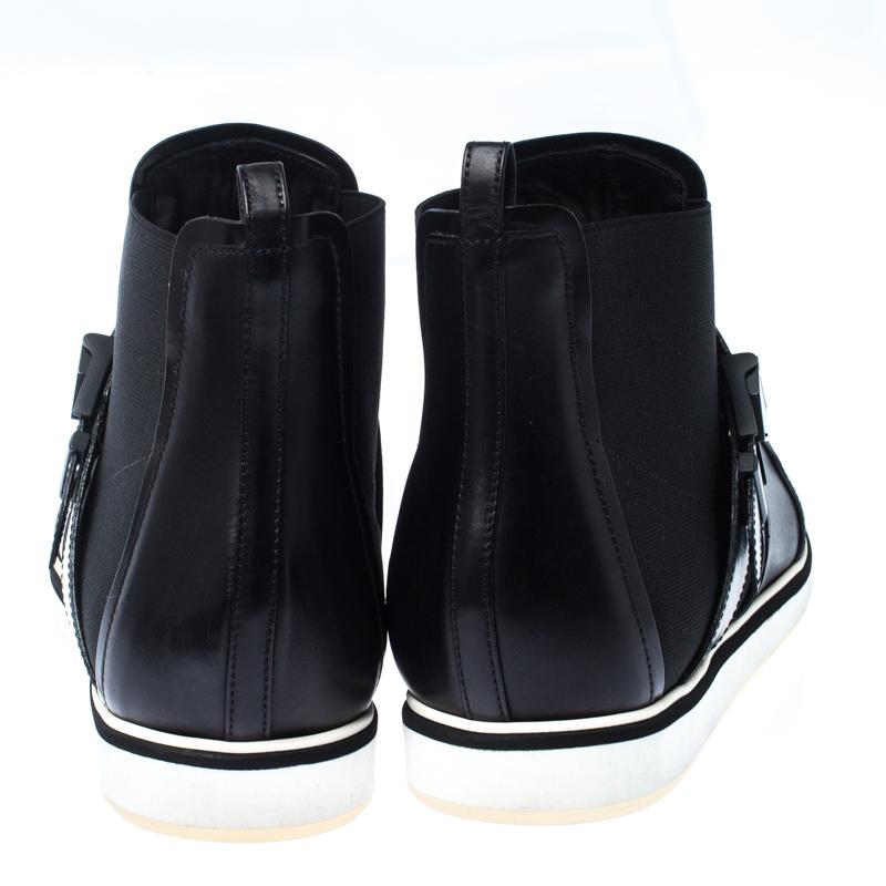 These boots from Nicholas Kirkwood come in a sneaker-like design. They are crafted from leather and stretch fabric into a design of pointed toes and buckle details. The insoles are lined with leather and the outsoles are set with rubber.

Includes: