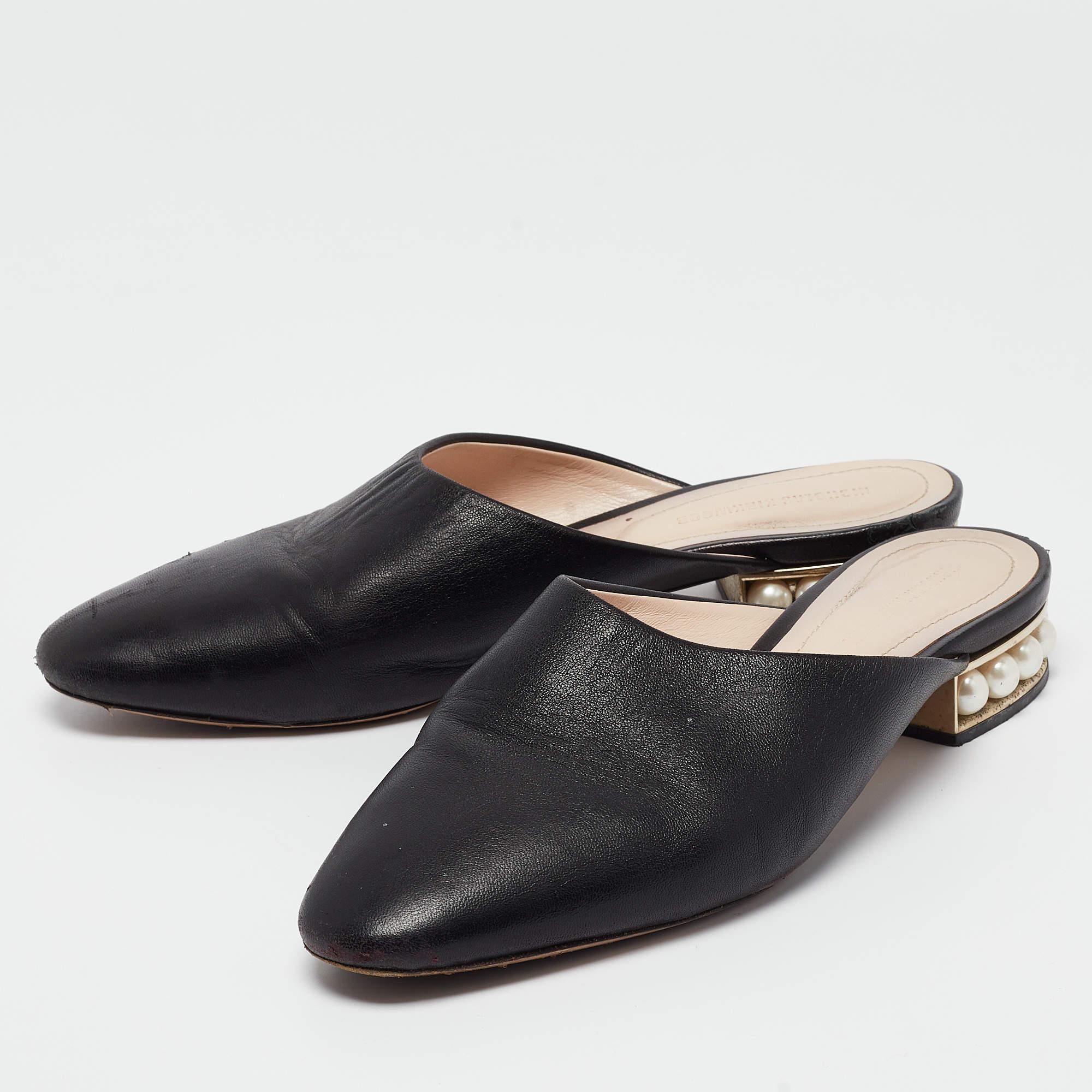 These Casati mules from Nicholas Kirkwood will not only make you shine but will also fetch you a lot of admiring glances. The black loafers are crafted from leather. They come equipped with comfortable leather lined insoles and faux pearl