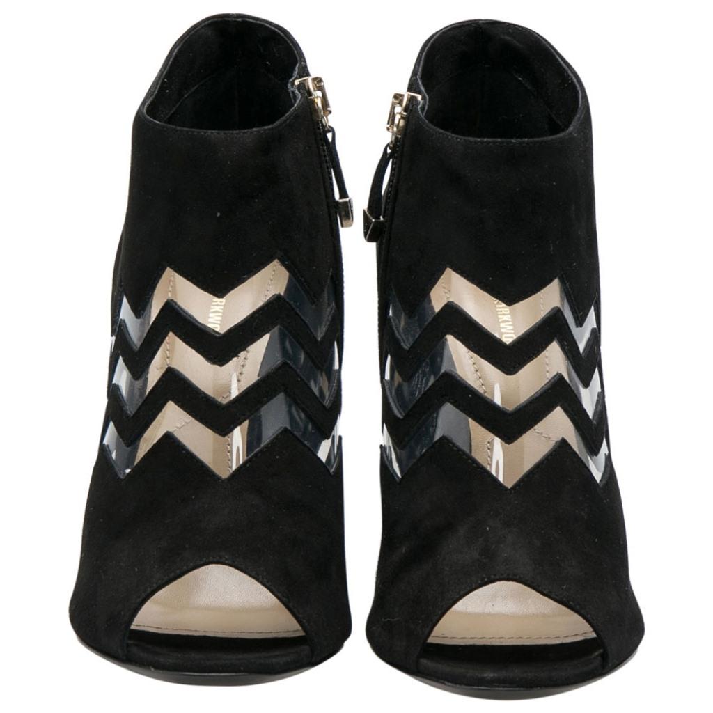 Crafted from black suede and detailed with PVC in a chevron pattern, these peep-toe booties from Nicholas Kirkwood have been purposely built to lift your style. They are complete with side zippers and 11 cm heels.

Includes: Original Box, Extra Top