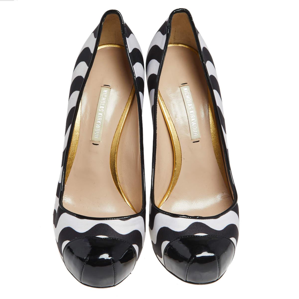 These pumps from the House of Nicholas Kirkwood are truly the best buy! They are crafted using black-white satin and patent leather and feature cap toes, a slip-on style, and slender heels. These pumps will revamp your style in seconds.

