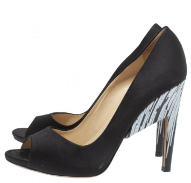 Statement pumps for you to outshine everyone else! These Nicholas Kirkwood beauties are crafted from satin and feature peep-toes. They come endowed with comfortable leather-lined insoles and will lift you up gracefully with their black and white 12