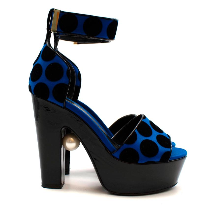 Nicholas Kirkwood Blue & Black Heeled Platform Sandals

-Luxurious blue satin with a black velvet polka dot motif 
-Iconic pearl to the heel 
-Soft leather lining for comfort 
-Patent leather platform 
-Chunky heel for stability 
-Patent leather