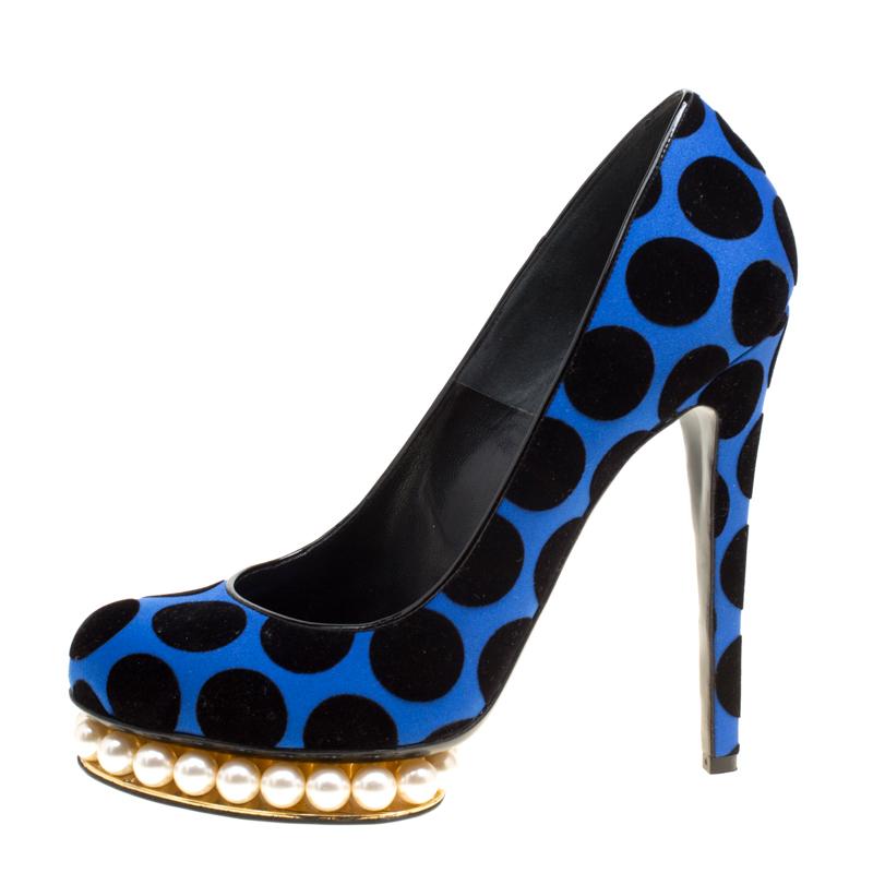 Step out in sophisticated style with these platform pumps from the luxury fashion house of Nicholas Kirkwood. They are crafted from satin, velvet and patent leather and feature a polka dot pattern on the exterior. They come with faux pearls inlaid