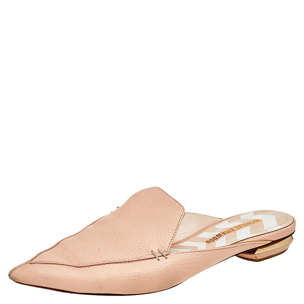 The Beya mules reflect Nicholas Kirkwood's dedication to flawless craftsmanship. The stylish slip-on mules are covered in cream leather and feature pointed toes and well-carved low heels. This versatile pair will work well with chic workwear and