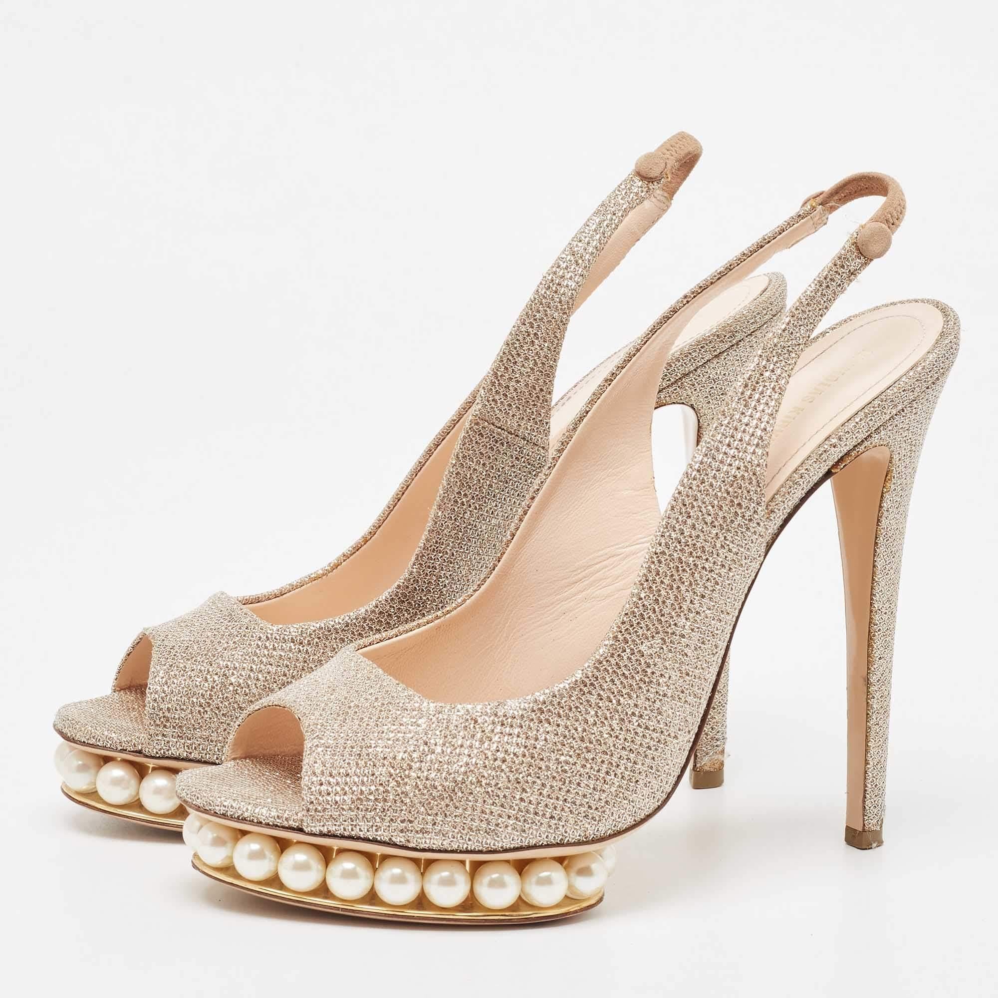 Statement sandals for you to outshine everyone else These Nicholas Kirkwood beauties are crafted from lurex fabric and feature peep toes and slingbacks. They are creatively detailed with pearl embellishments on the platforms and come endowed with