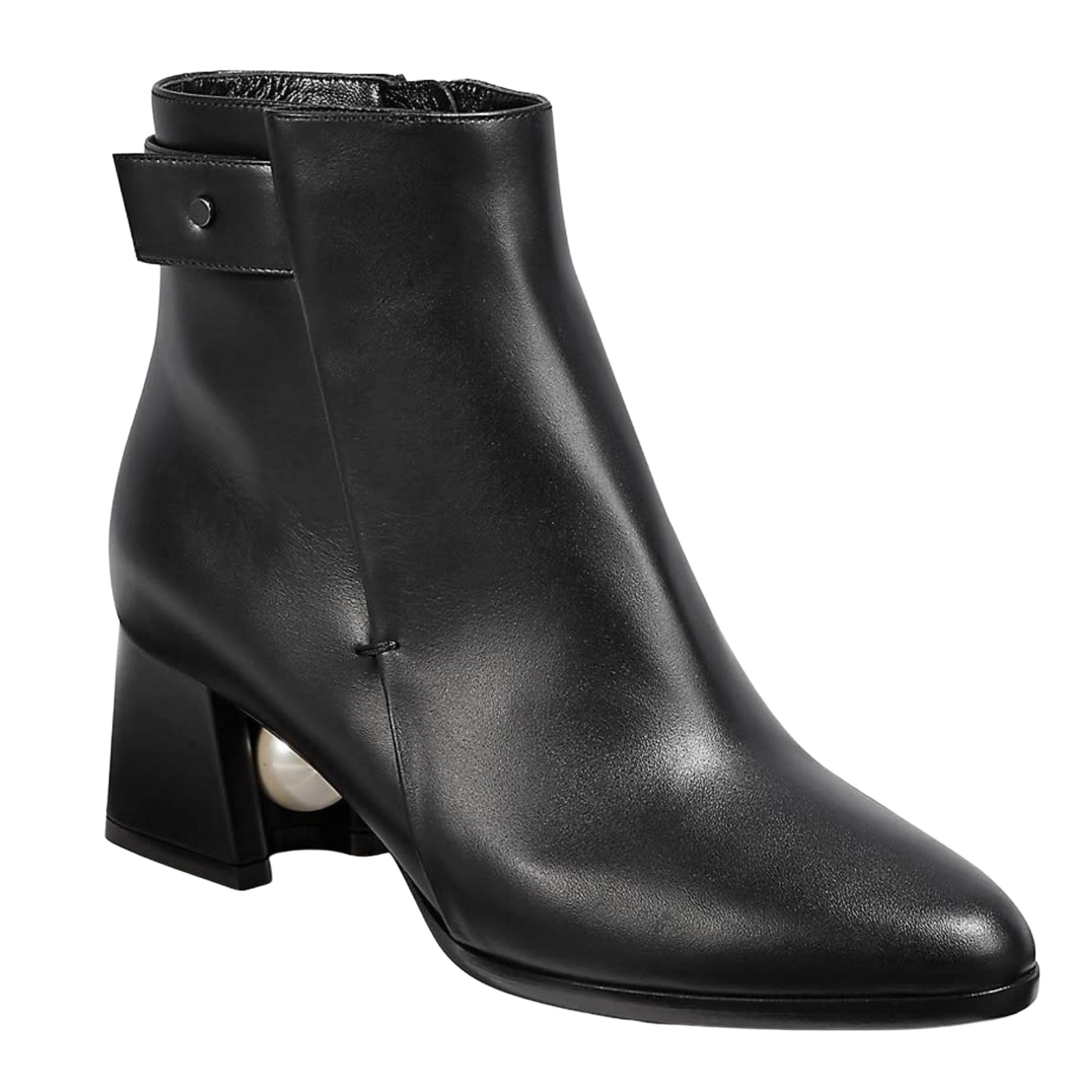  These leather ankle boots feature a classic Nicholas Kirkwood faux pearl under the heel for a chic look. Leather upper, almond toe, side zip, leather lining and leather sole. (905A07VLS1-N99-36.0)

COLOR: Black
MATERIAL: Leather
SIZE: 36 EU / 5