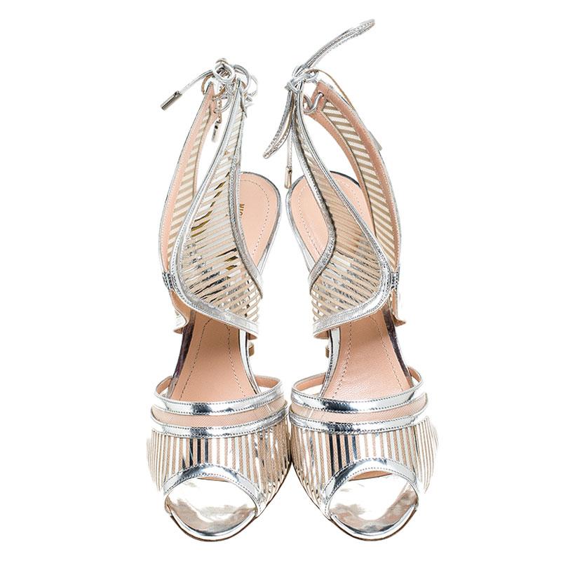 Flaunt style at its best with these beautiful patent leather sandals. These stylish sandals feature cutout design all over the uppers, high heels and ties at the back. Amp up your style quotient as you glam up your casual outfit with these gorgeous